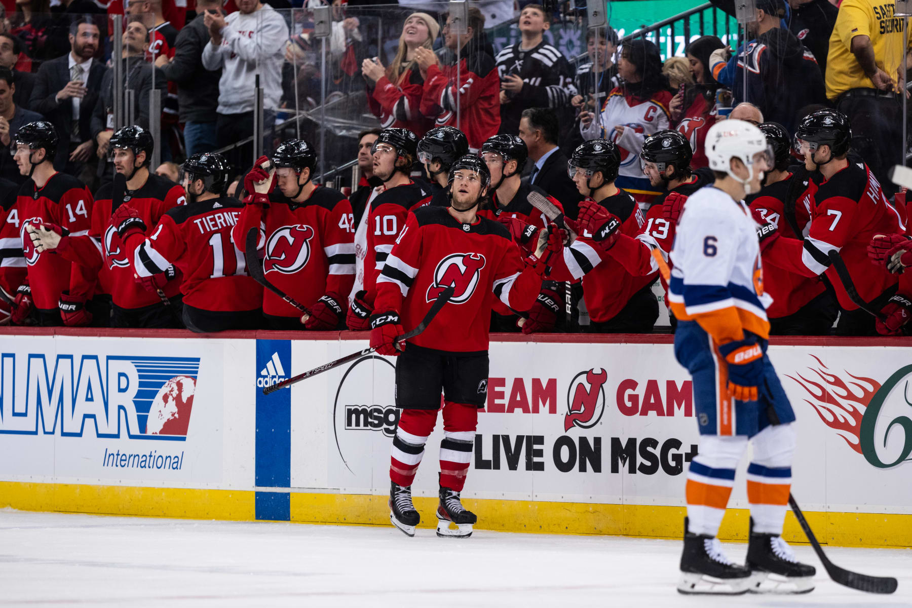NEWARK, NEW JERSEY - NOVEMBER 28: Dawson Mercer #91 of the New Jersey Devils celebrates a second period goal with teammates during a game against the New Jersey Devils at Prudential Center on November 28, 2023 in Newark, New Jersey. (Photo by Michael Mooney/2023 NHLI)
