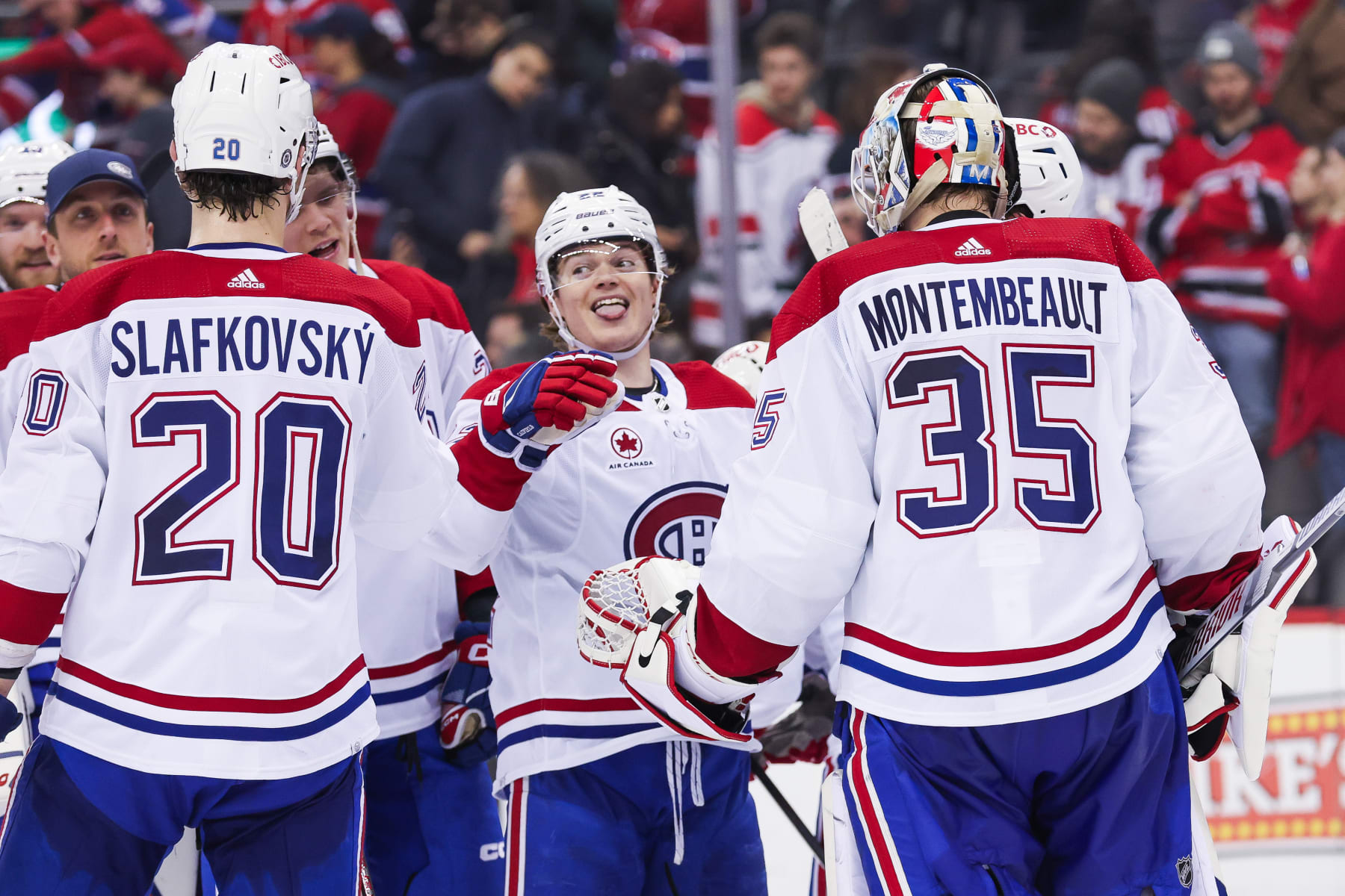 NEWARK, NJ - JANUARY 17: Montreal Canadiens right wing Cole Caufield (22) celebrates with Montreal Canadiens goaltender Sam Montembeault (35) after winning a game between the Montreal Canadiens and New Jersey Devils on January 17, 2024 at Prudential Center in the Newark, New Jersey. (Photo by Andrew Mordzynski/Icon Sportswire via Getty Images)