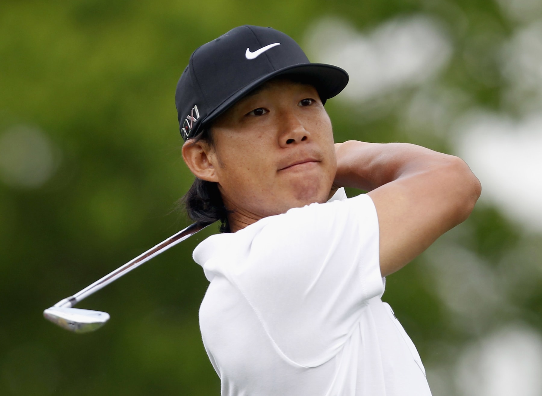 HUMBLE, TX - MARCH 29:  Anthony Kim watches his tee shot on the ninth hole during the completion of the weather-delayed first round of the Shell Houston Open at Redstone Golf Club on March 30, 2012 in Humble, Texas.  (Photo by Matt Sullivan/Getty Images)