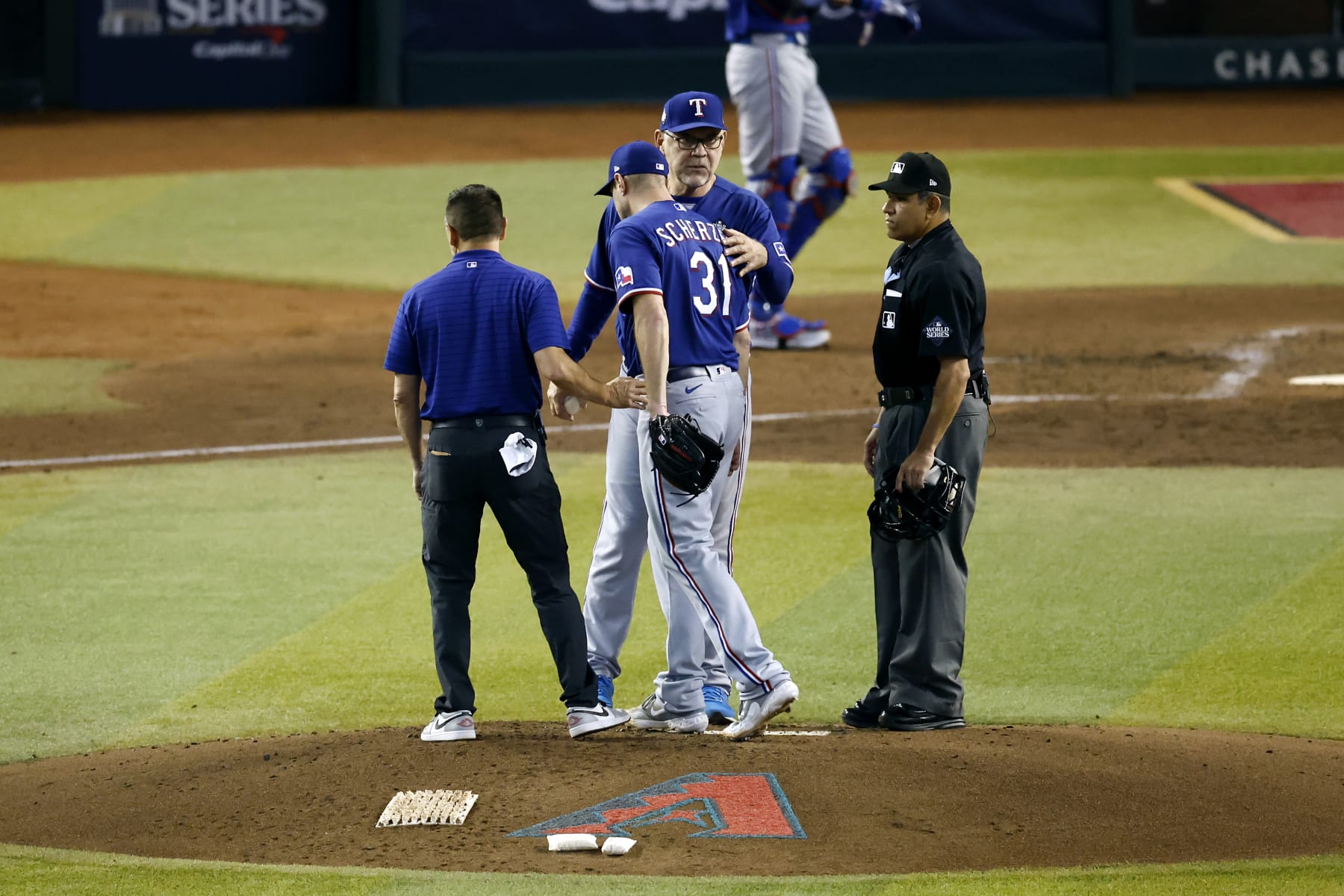 PHOENIX, AZ - OCTOBER 30:  Max Scherzer #31 of the Texas Rangers is taken out of the game by manager Bruce Bochy #15 in the fourth inning during Game 3 of the 2023 World Series between the Texas Rangers and the Arizona Diamondbacks at Chase Field on Monday, October 30, 2023 in Phoenix, Arizona. (Photo by Chris Coduto/MLB Photos via Getty Images)