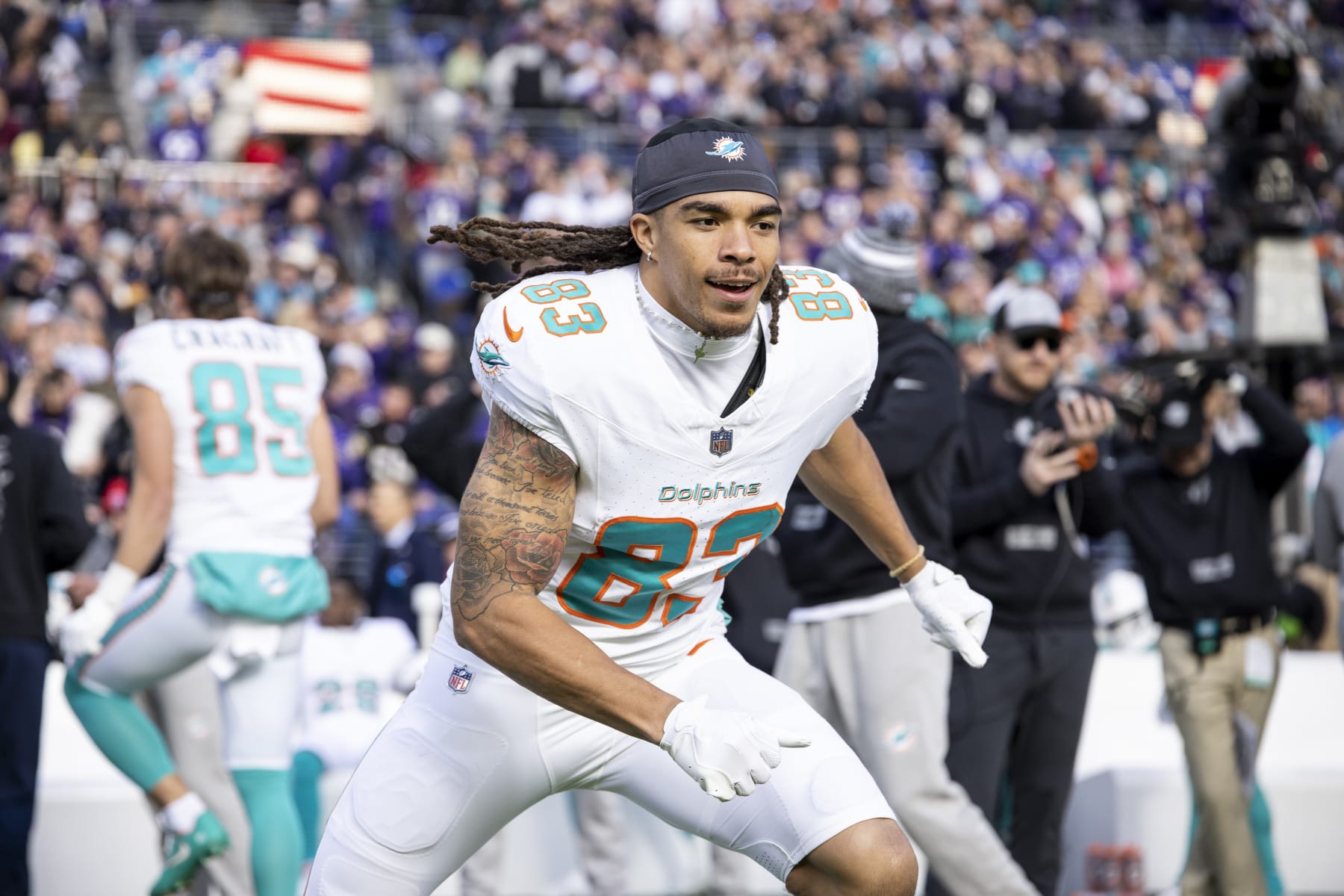 BALTIMORE, MARYLAND - DECEMBER 31: Chase Claypool #83 of the Miami Dolphins reacts as he runs prior to an NFL football game between the Baltimore Ravens and the Miami Dolphins at M&T Bank Stadium on December 31, 2023 in Baltimore, Maryland. (Photo by Michael Owens/Getty Images)