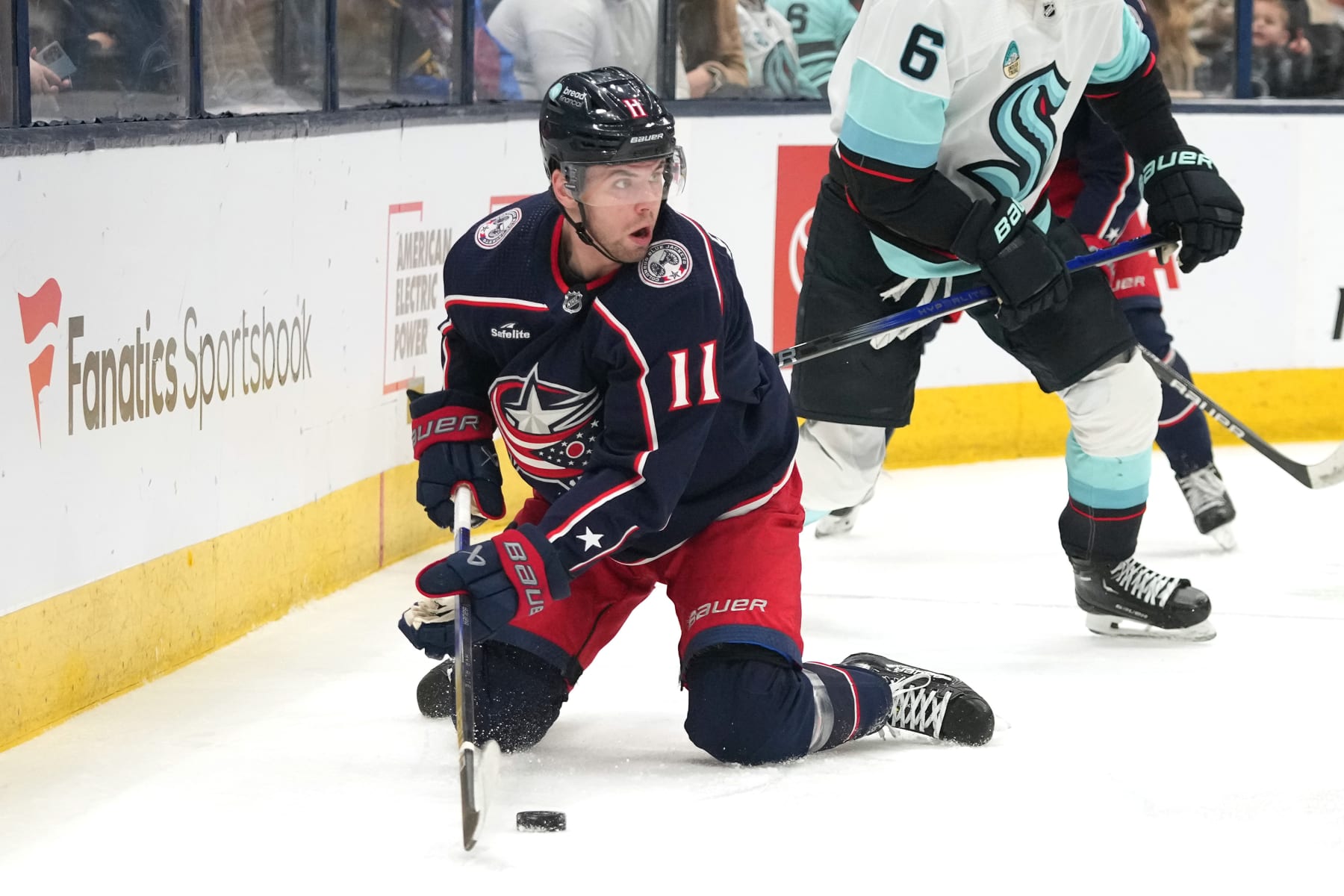 COLUMBUS, OHIO - JANUARY 13: Adam Fantilli #11 of the Columbus Blue Jackets plays the puck from his knees during the second period against the Seattle Kraken at Nationwide Arena on January 13, 2024 in Columbus, Ohio. (Photo by Jason Mowry/Getty Images)