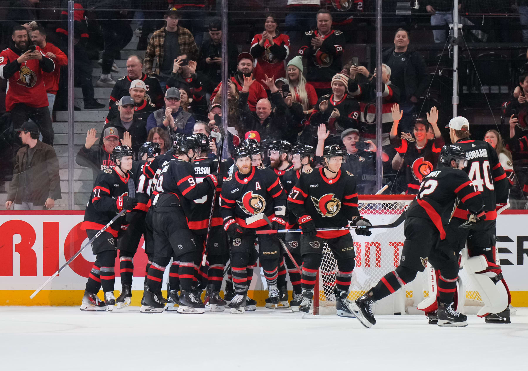OTTAWA, CANADA - JANUARY 29: Claude Giroux #28 of the Ottawa Senators celebrates his game winning overtime goal against the Nashville Predators with teammates at Canadian Tire Centre on January 29, 2024 in Ottawa, Ontario, Canada. (Photo by André Ringuette/NHLI via Getty Images)