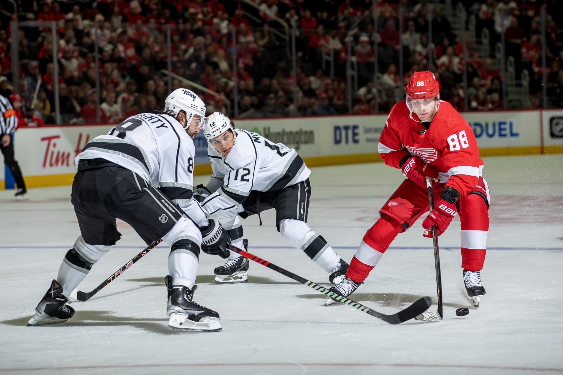 DETROIT, MI - JANUARY 13: Drew Doughty #8 of the Los Angeles Kings defends against Patrick Kane #88 of the Detroit Red Wings during first period at Little Caesars Arena. (Photo by Dave Reginek/NHLI via Getty Images)