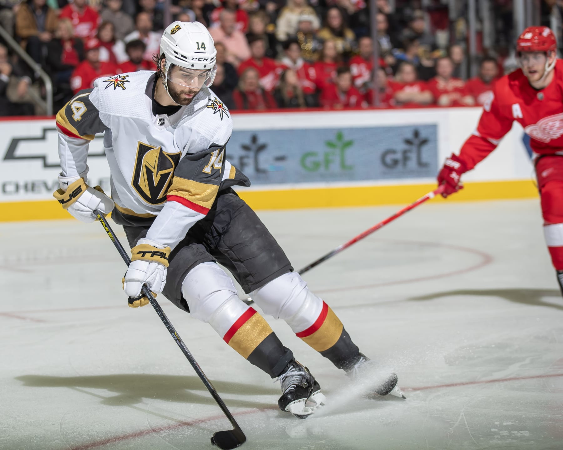 DETROIT, MI - JANUARY 27: Nicolas Hague #14 of the Vegas Golden Knights turns with the puck against the Detroit Red Wings during the third period at Little Caesars Arena on January 27, 2024 in Detroit, Michigan. Detroit defeated Vegas 5-2. (Photo by Dave Reginek/NHLI via Getty Images)
