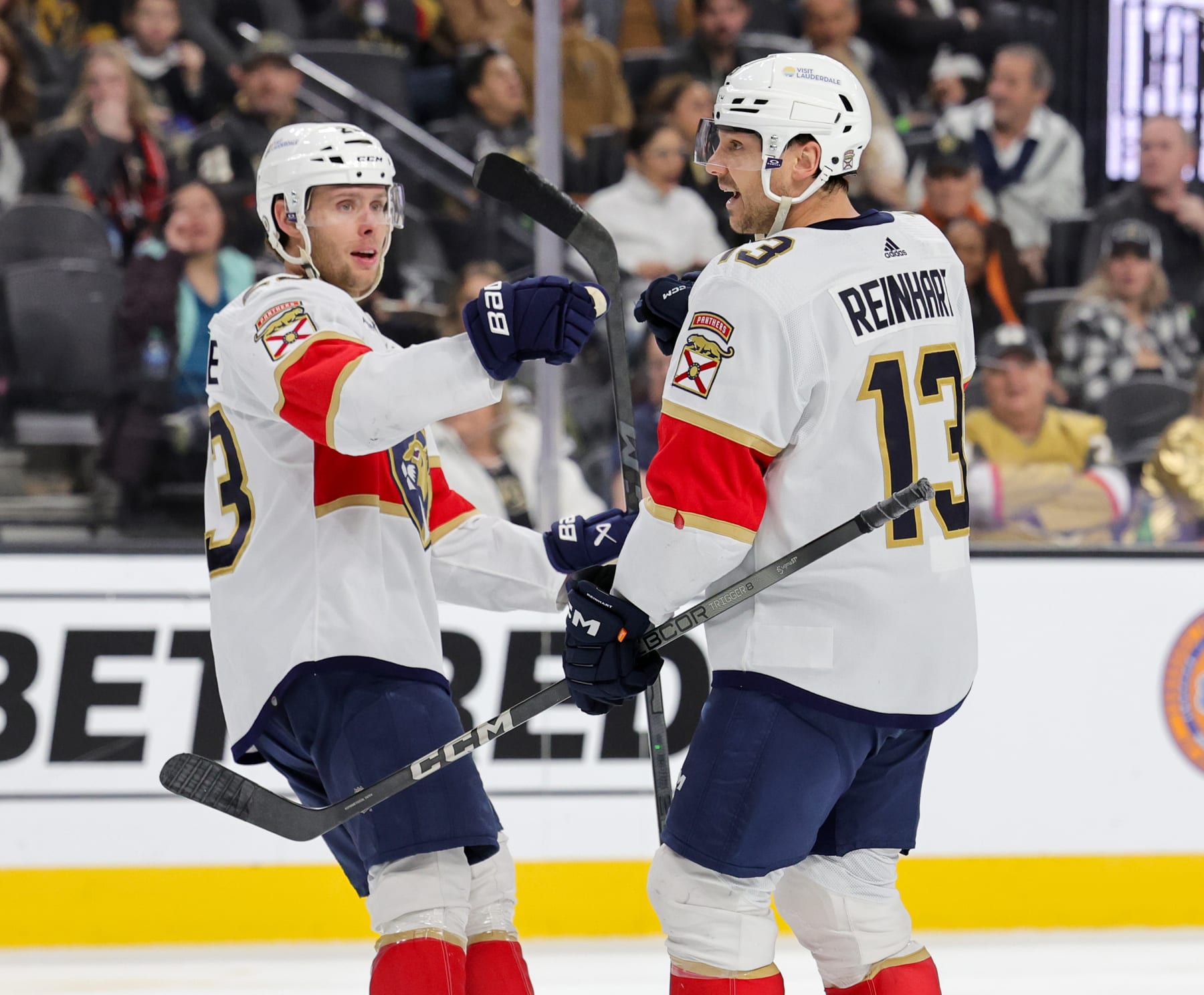 LAS VEGAS, NEVADA - JANUARY 04: Carter Verhaeghe #23 and Sam Reinhart #13 of the Florida Panthers celebrate after Verhaeghe assisted Reinhart on a third-period power-play goal against the Vegas Golden Knights during their game at T-Mobile Arena on January 04, 2024 in Las Vegas, Nevada. The Panthers defeated the Golden Knights 4-1. (Photo by Ethan Miller/Getty Images)