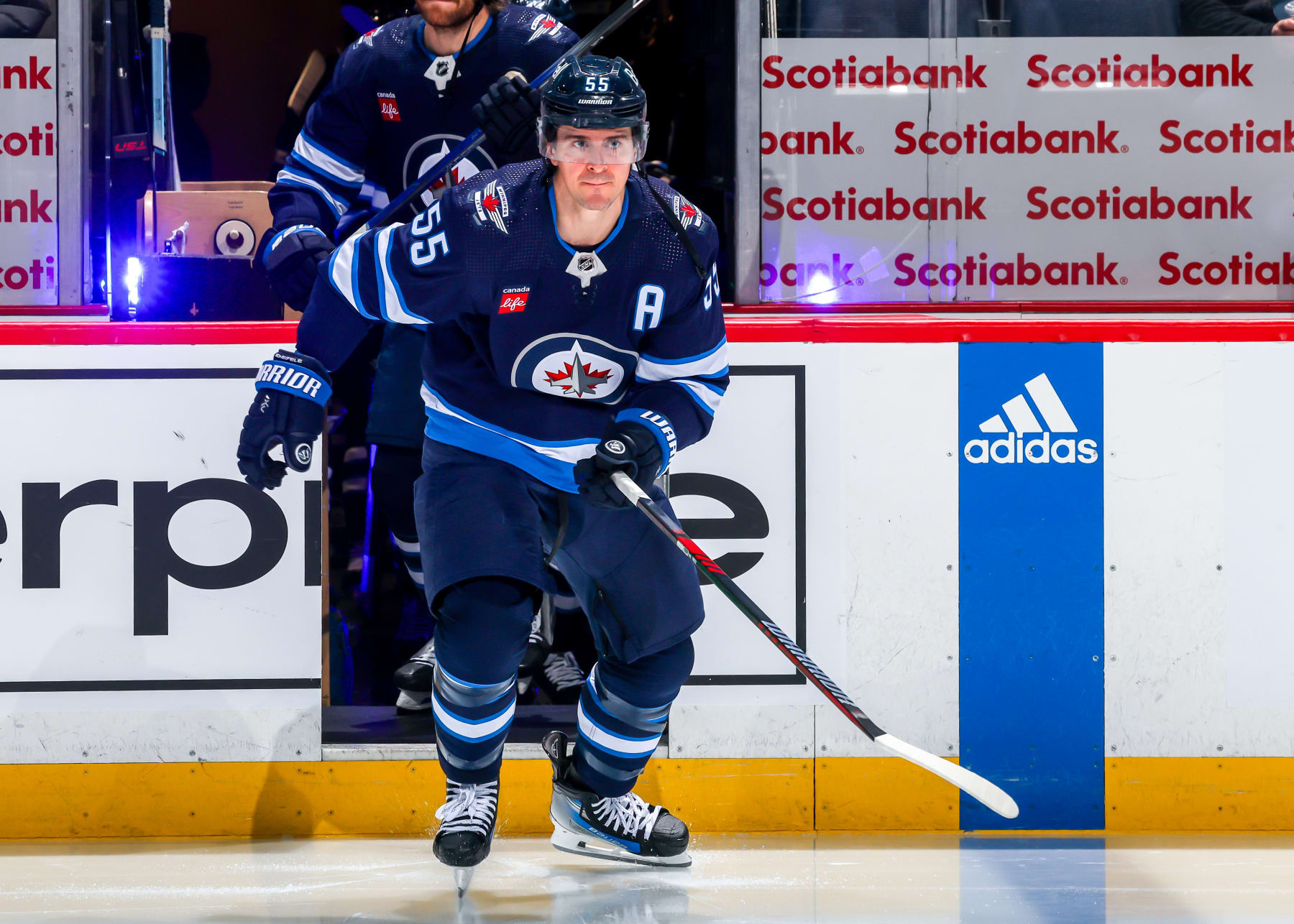 WINNIPEG, CANADA - JANUARY 11: Mark Scheifele #55 of the Winnipeg Jets hits the ice prior to NHL action against the Chicago Blackhawks at Canada Life Centre on January 11, 2024 in Winnipeg, Manitoba, Canada. (Photo by Jonathan Kozub/NHLI via Getty Images)