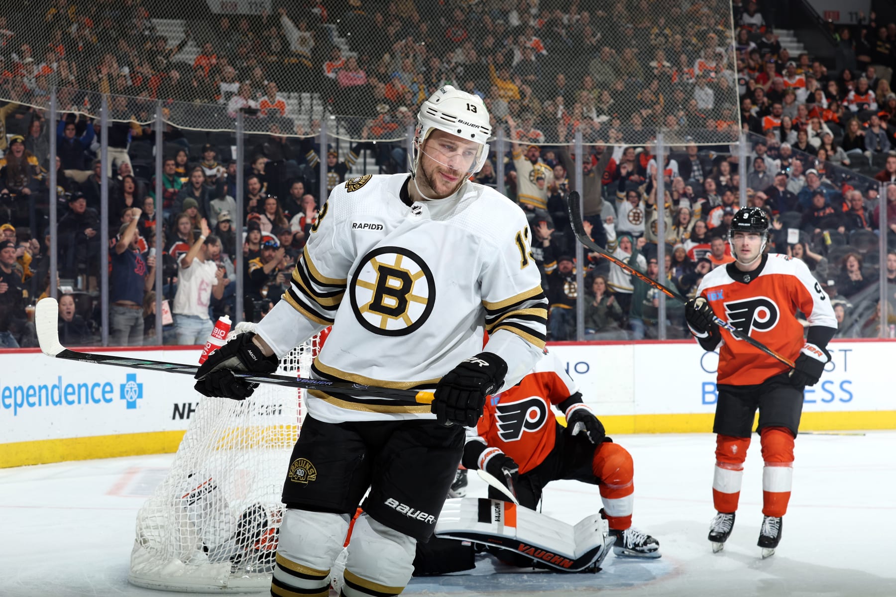PHILADELPHIA, PENNSYLVANIA - JANUARY 27: Charlie Coyle #13 of the Boston Bruins reacts after scoring during the third period against the Philadelphia Flyersat the Wells Fargo Center on January 27, 2024 in Philadelphia, Pennsylvania. (Photo by Tim Nwachukwu/Getty Images)
