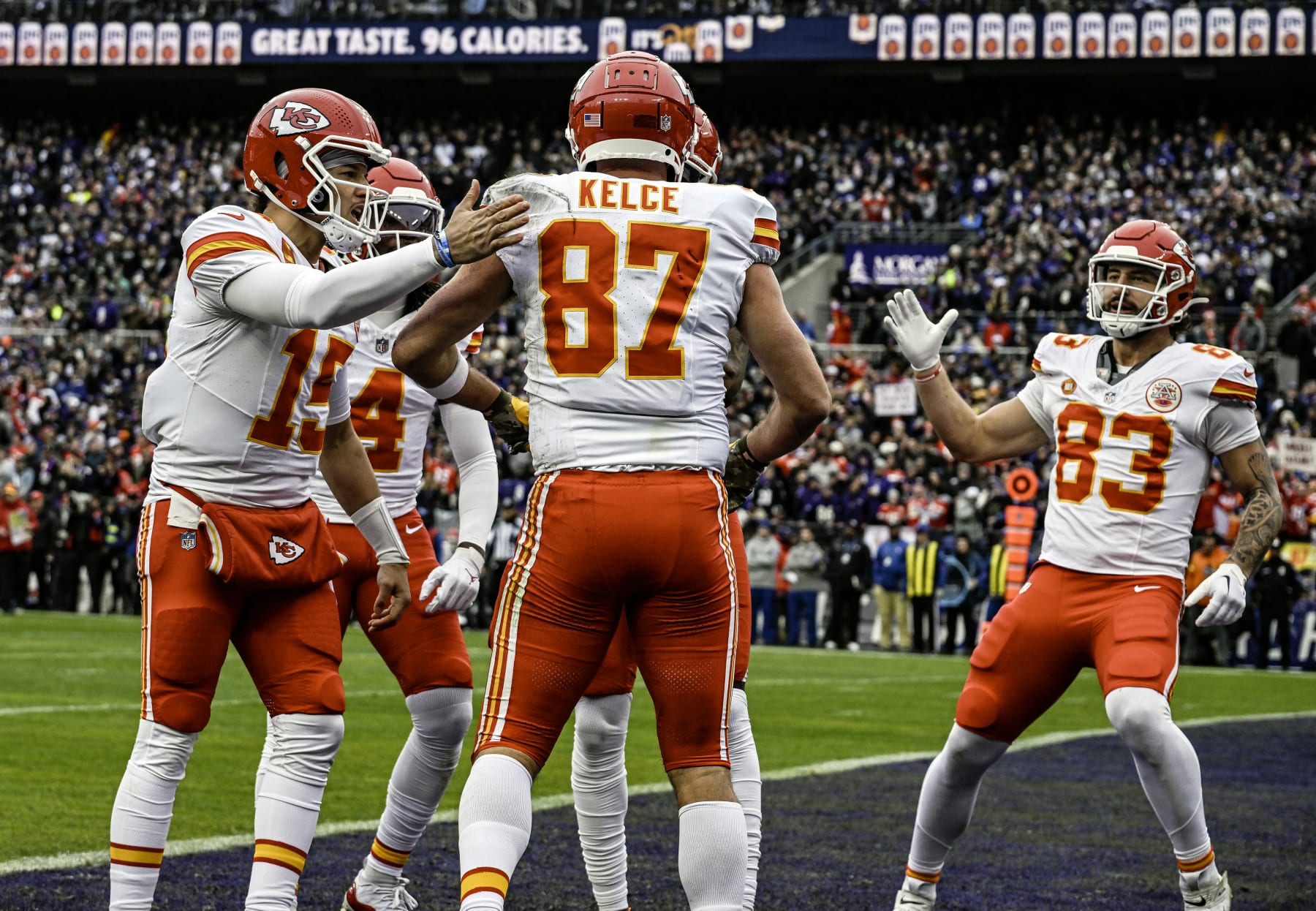 BALTIMORE, MD - JANUARY 28: Kansas City Chiefs tight end Travis Kelce (87) is congratulated by quarterback Patrick Mahomes (15) and tight end Noah Gray (83) after catching a touchdown pass in the first quarter during the Kansas City Chiefs game versus the Baltimore Ravens in the AFC Championship Game on January 28, 2024 at M&T Bank Stadium in Baltimore, MD. (Photo by Mark Goldman/Icon Sportswire via Getty Images)