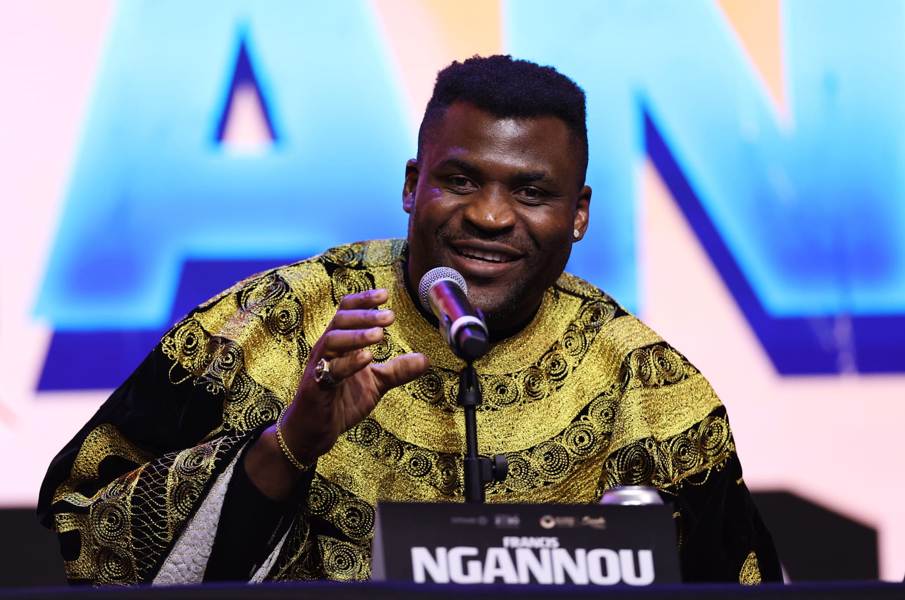LONDON, ENGLAND - JANUARY 15: Francis Ngannou speaks during the Anthony Joshua v Francis Ngannou Press Conference at Outernet London on January 15, 2024 in London, England. (Photo by Alex Pantling/Getty Images)