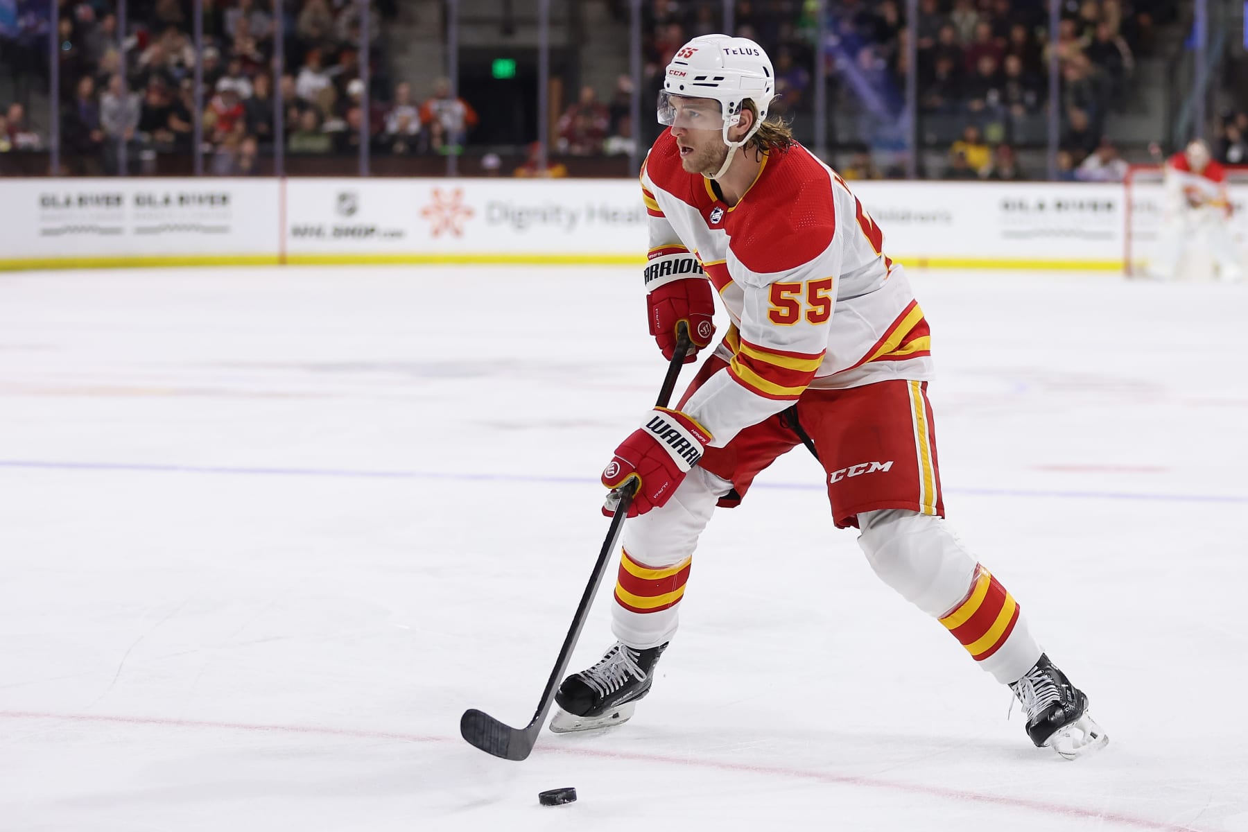 TEMPE, ARIZONA - JANUARY 11: Noah Hanifin #55 of the Calgary Flames skates with the puck during the first period of the NHL game at Mullett Arena on January 11, 2024 in Tempe, Arizona. (Photo by Christian Petersen/Getty Images)