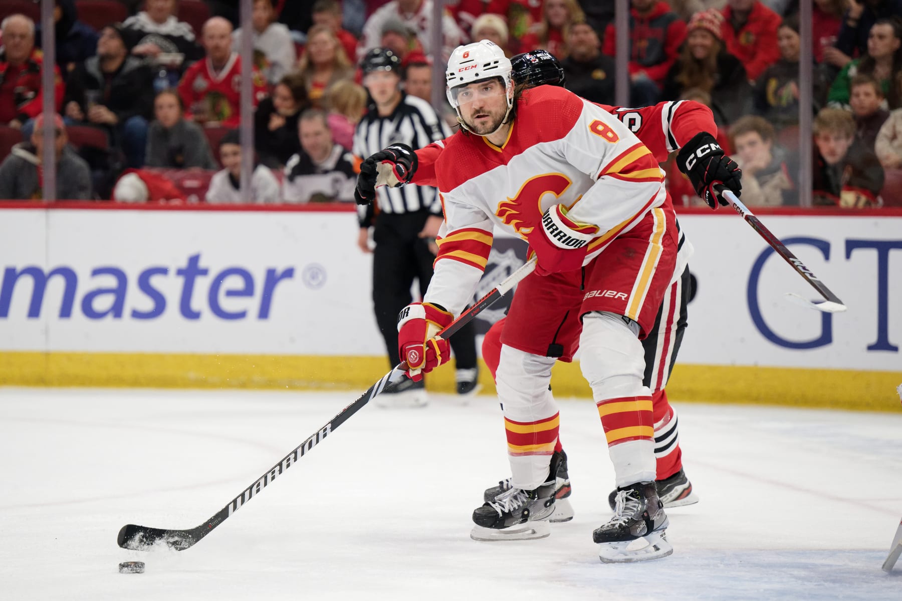 CHICAGO, ILLINOIS - JANUARY 07: Chris Tanev #8 of the Calgary Flames skates against the Chicago Blackhawks on January 07, 2024 at United Center in Chicago, Illinois. (Photo by Jamie Sabau/Getty Images)