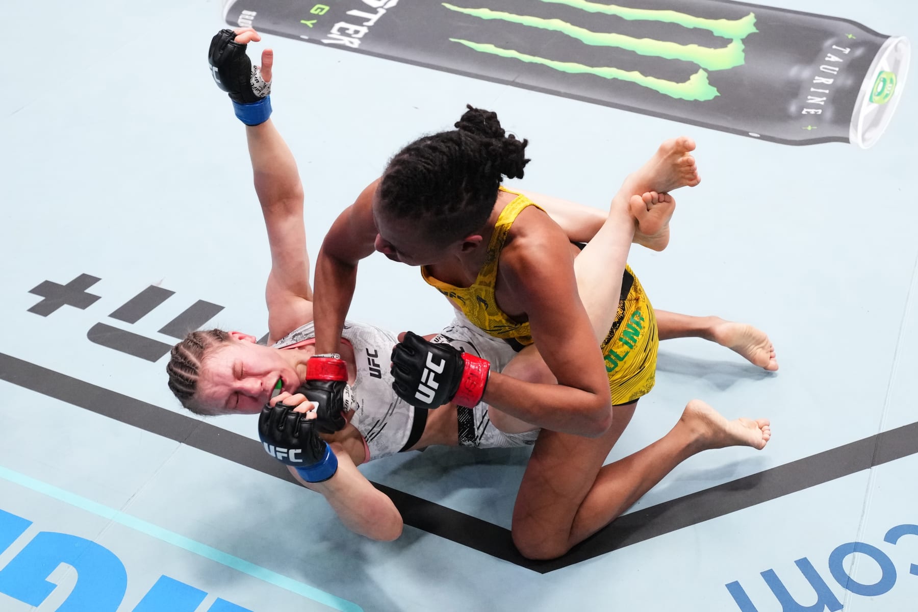 LAS VEGAS, NEVADA - FEBRUARY 03: (R-L) Luana Carolina of Brazil punches Julija Stoliarenko of Lithuania in a flyweight fight during the UFC Fight Night event at UFC APEX on February 03, 2024 in Las Vegas, Nevada. (Photo by Chris Unger/Zuffa LLC via Getty Images)
