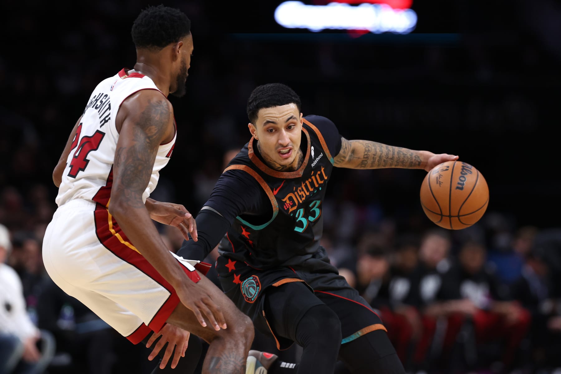 WASHINGTON, DC - FEBRUARY 02: Kyle Kuzma #33 of the Washington Wizards dribbles in front of Haywood Highsmith #24 of the Miami Heat during the first half at Capital One Arena on February 2, 2024 in Washington, DC. NOTE TO USER: User expressly acknowledges and agrees that, by downloading and or using this photograph, User is consenting to the terms and conditions of the Getty Images License Agreement. (Photo by Patrick Smith/Getty Images)