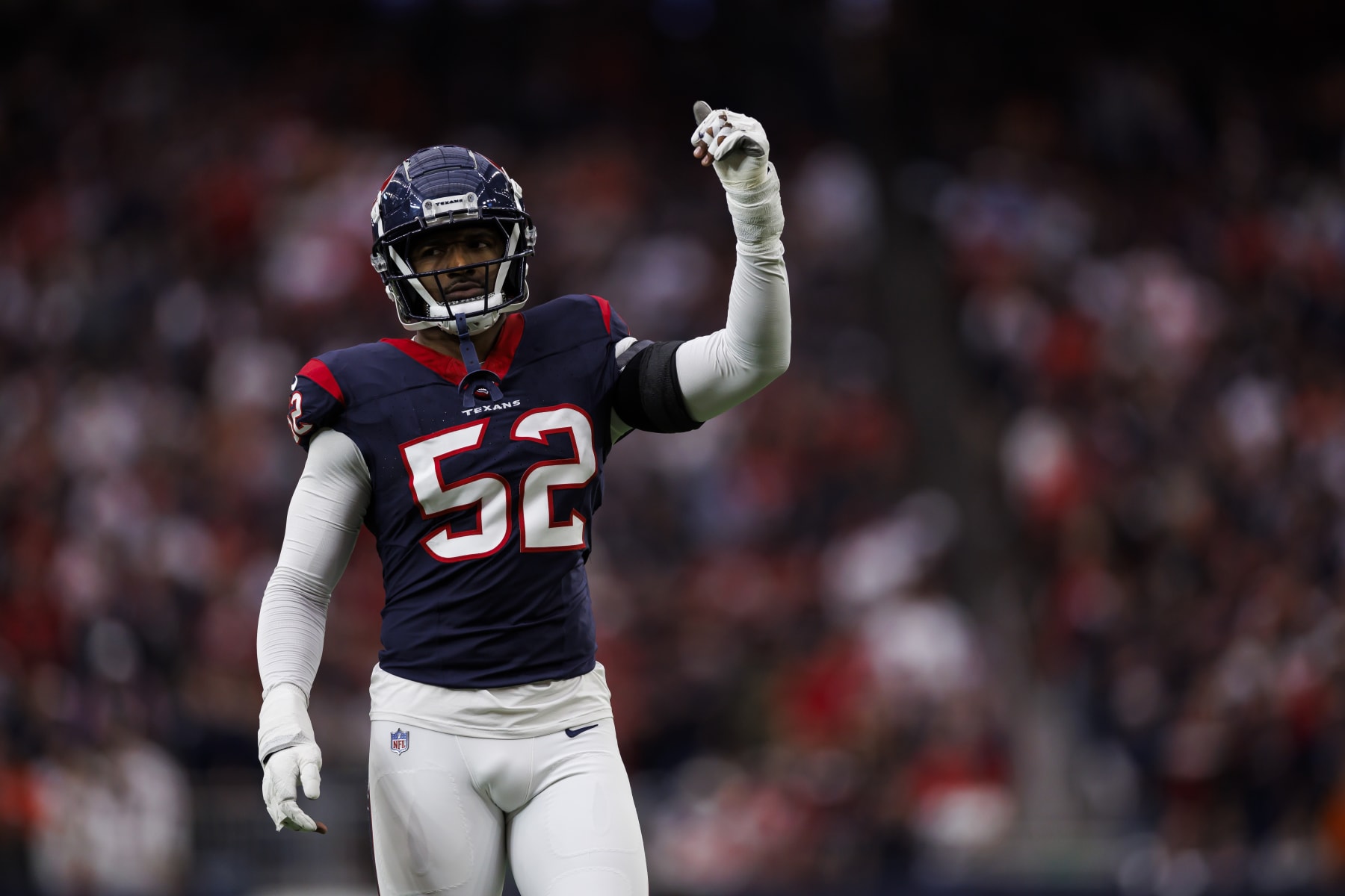 HOUSTON, TEXAS - JANUARY 13: Jonathan Greenard #52 of the Houston Texans celebrates during an AFC wild-card playoff football game against the Cleveland Browns at NRG Stadium on January 13, 2024 in Houston, Texas. (Photo by Ryan Kang/Getty Images)
