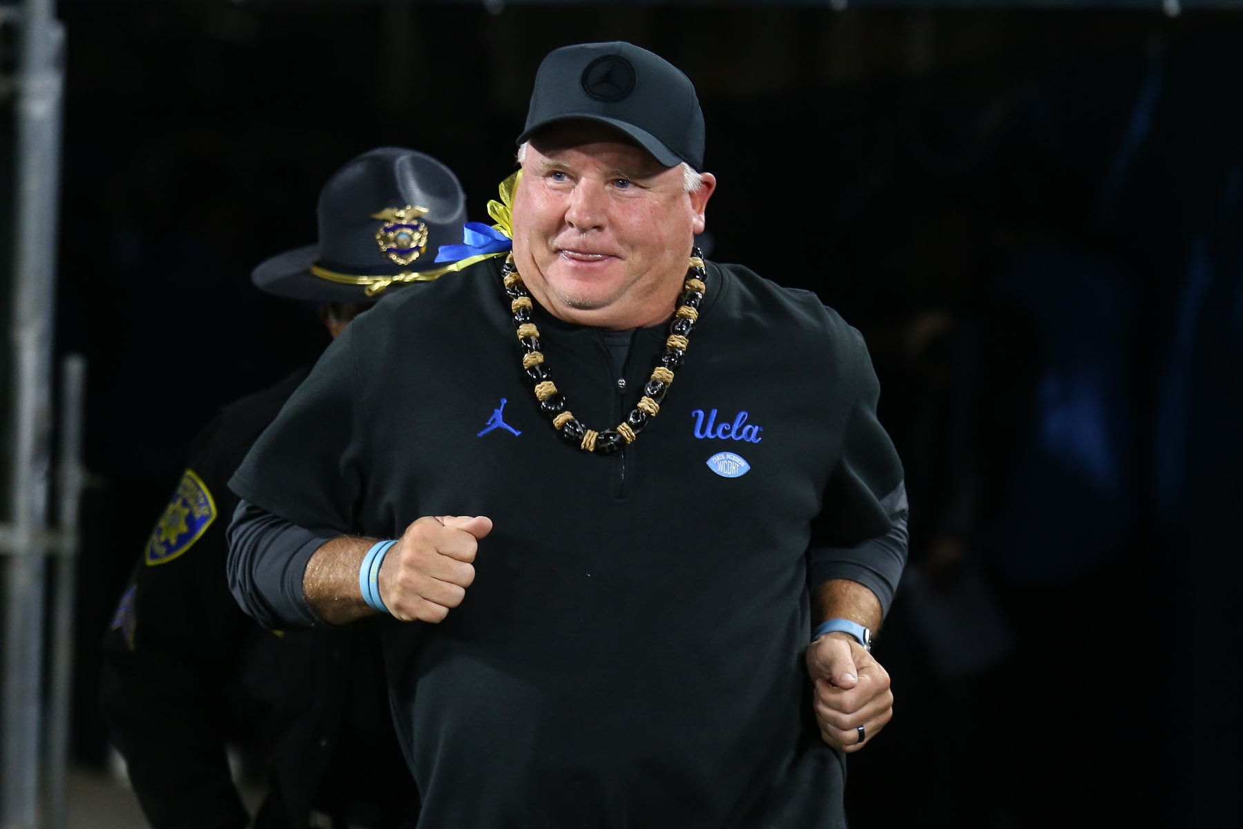 PASADENA, CA - NOVEMBER 25: UCLA Bruins head coach Chip Kelly runs on the field during Cal Bears game versus the UCLA Bruins in the last Pac-12 Conference football game played on November 25, 2023, at the Rose Bowl Stadium in Pasadena, CA. (Photo by Jevone Moore/Icon Sportswire via Getty Images)
