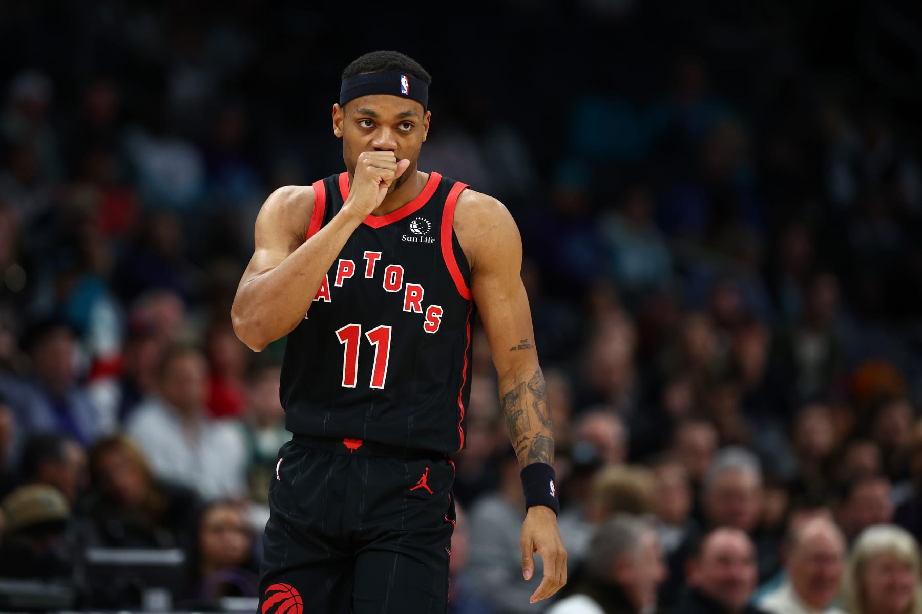 CHARLOTTE, NORTH CAROLINA - FEBRUARY 07: Bruce Brown #11 of the Toronto Raptors reacts during the first half of the game against the Charlotte Hornets at Spectrum Center on February 07, 2024 in Charlotte, North Carolina. NOTE TO USER: User expressly acknowledges and agrees that, by downloading and or using this photograph, User is consenting to the terms and conditions of the Getty Images License Agreement. (Photo by Jared C. Tilton/Getty Images)