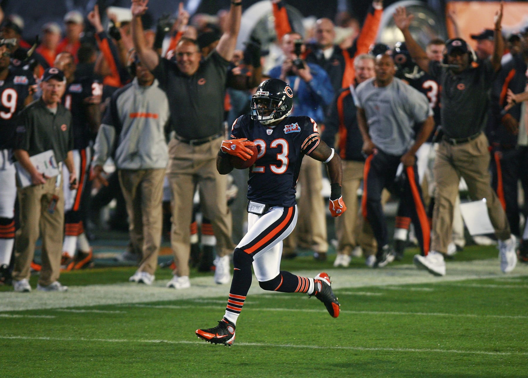 MIAMI GARDENS, FL - FEBRUARY 04:  Kick returner Devin Hester #23 of the Chicago Bears returns the openning kickoff 92-yards for a touchdown against the Indianapolis Colts in the first quarter of Super Bowl XLI on February 4, 2007 at Dolphin Stadium in Miami Gardens, Florida.  (Photo by Doug Benc/Getty Images)