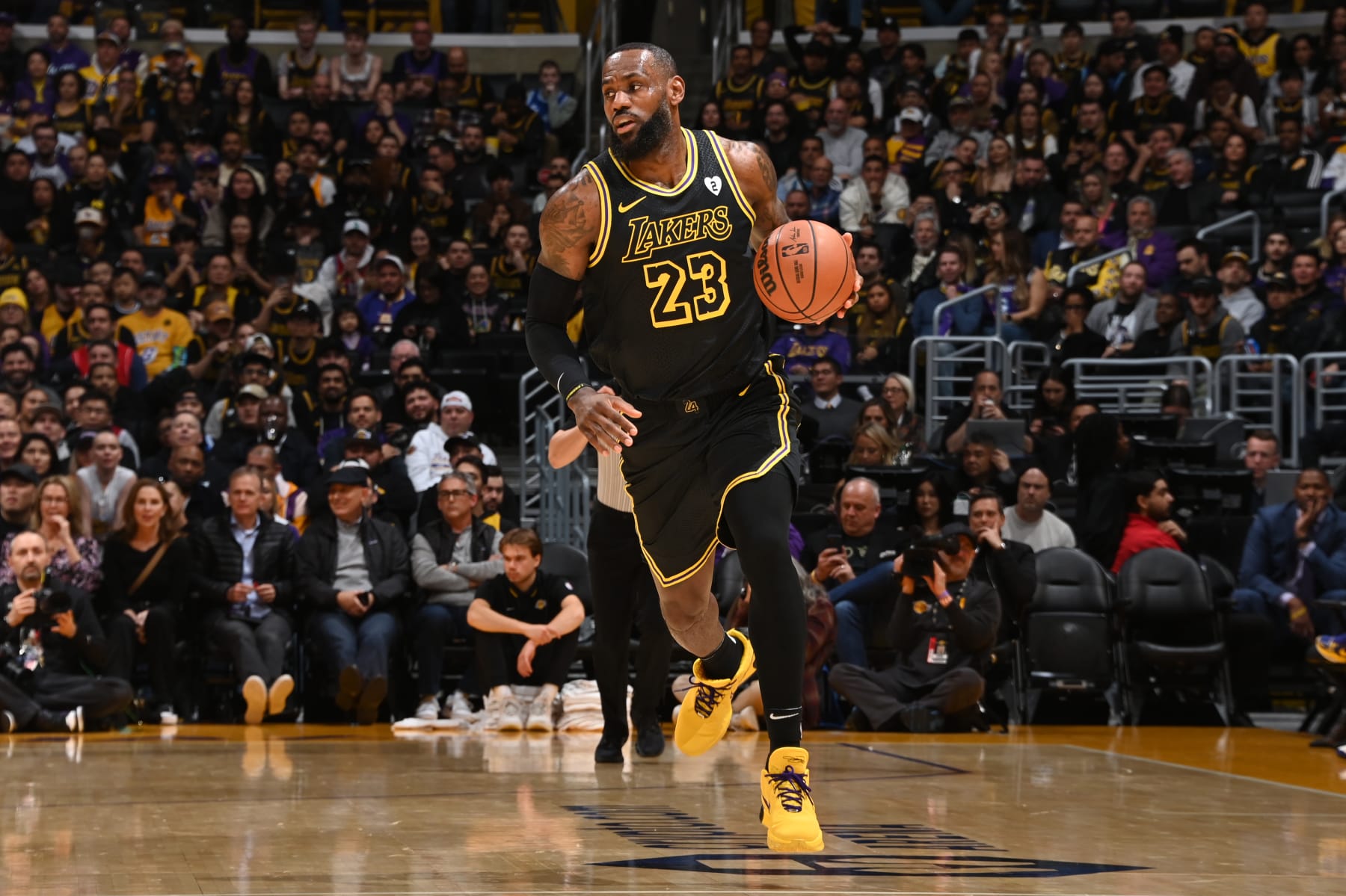 LOS ANGELES, CA - FEBRUARY 8: LeBron James #23 of the Los Angeles Lakers dribbles the ball during the game against the Denver Nuggets on Feburary 8, 2024 at Crypto.Com Arena in Los Angeles, California. NOTE TO USER: User expressly acknowledges and agrees that, by downloading and/or using this Photograph, user is consenting to the terms and conditions of the Getty Images License Agreement. Mandatory Copyright Notice: Copyright 2024 NBAE (Photo by Andrew D. Bernstein/NBAE via Getty Images)