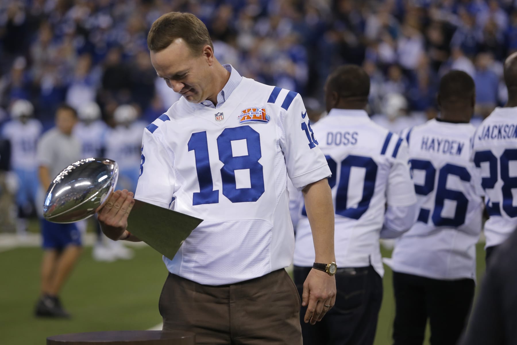 INDIANAPOLIS, IN - NOVEMBER 20: Payton Manning takes a second and looks at the Super Bowl Trophy after the 2007 Super Bowl Tteam was introduced at halftime during an NFL football game between the Tennessee Titans and the Indianapolis Colts on November 20, 2016, at Lucas Oil Stadium in Indianapolis IN. (Photo by Jeffrey Brown/Icon Sportswire via Getty Images)