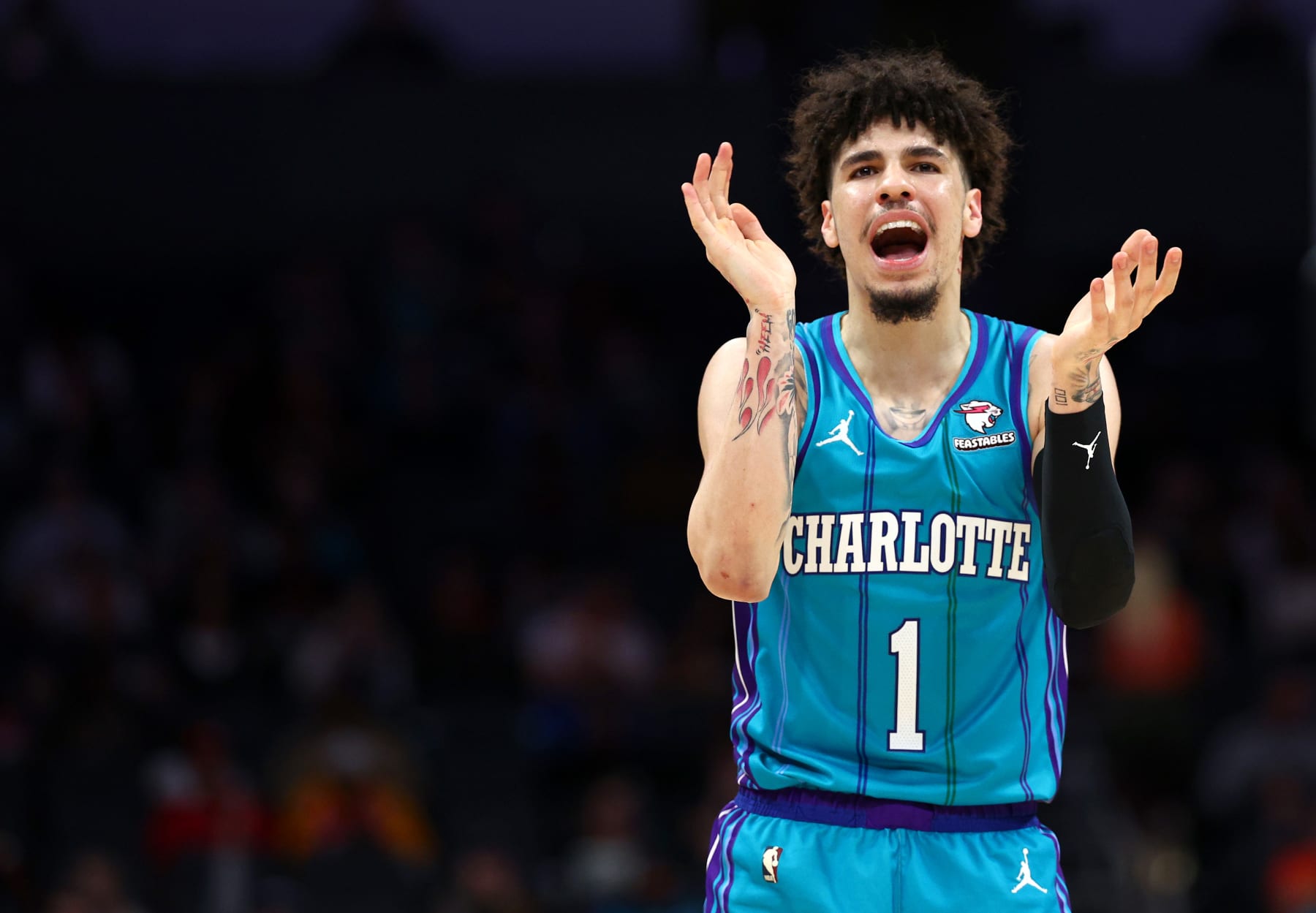 CHARLOTTE, NORTH CAROLINA - JANUARY 26: LaMelo Ball #1 of the Charlotte Hornets reacts during the second half of the game against the Houston Rockets at Spectrum Center on January 26, 2024 in Charlotte, North Carolina. NOTE TO USER: User expressly acknowledges and agrees that, by downloading and or using this photograph, User is consenting to the terms and conditions of the Getty Images License Agreement. (Photo by Jared C. Tilton/Getty Images)