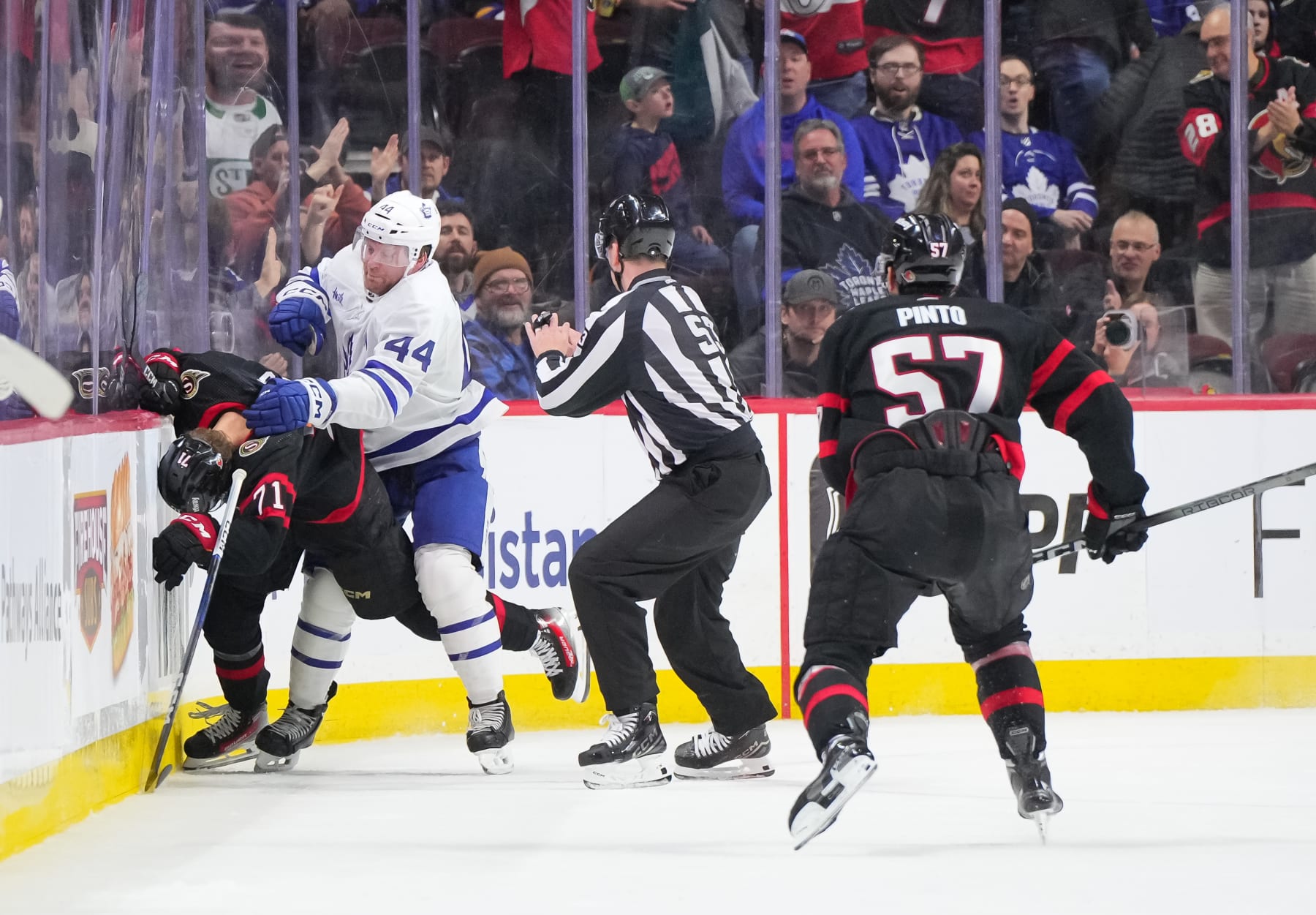 OTTAWA, CANADA - FEBRUARY 10: Morgan Rielly #44 of the Toronto Maple Leafs stands over Ridly Greig #71 of the Ottawa Senators after being cross checked in the head following his empty net goal at Canadian Tire Centre on February 10, 2024 in Ottawa, Ontario, Canada. (Photo by Chris Tanouye/Freestyle Photography/Getty Images)