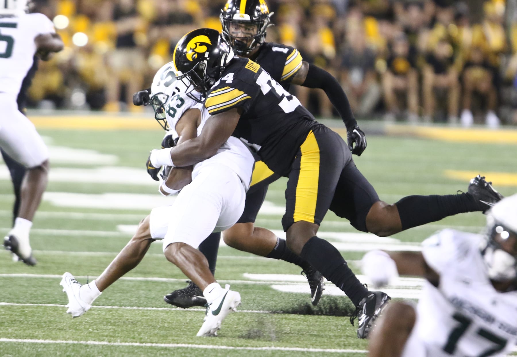 IOWA CITY, IOWA- SEPTEMBER 30: Linebacker Jay Higgins #34 of the Iowa Hawkeyes makes a tackle during the first half on wide receiver Montorie Foster Jr. #83 of the Michigan State Spartans at Kinnick Stadium on September 30, 2023 in Iowa City, Iowa. (Photo by Matthew Holst/Getty Images)