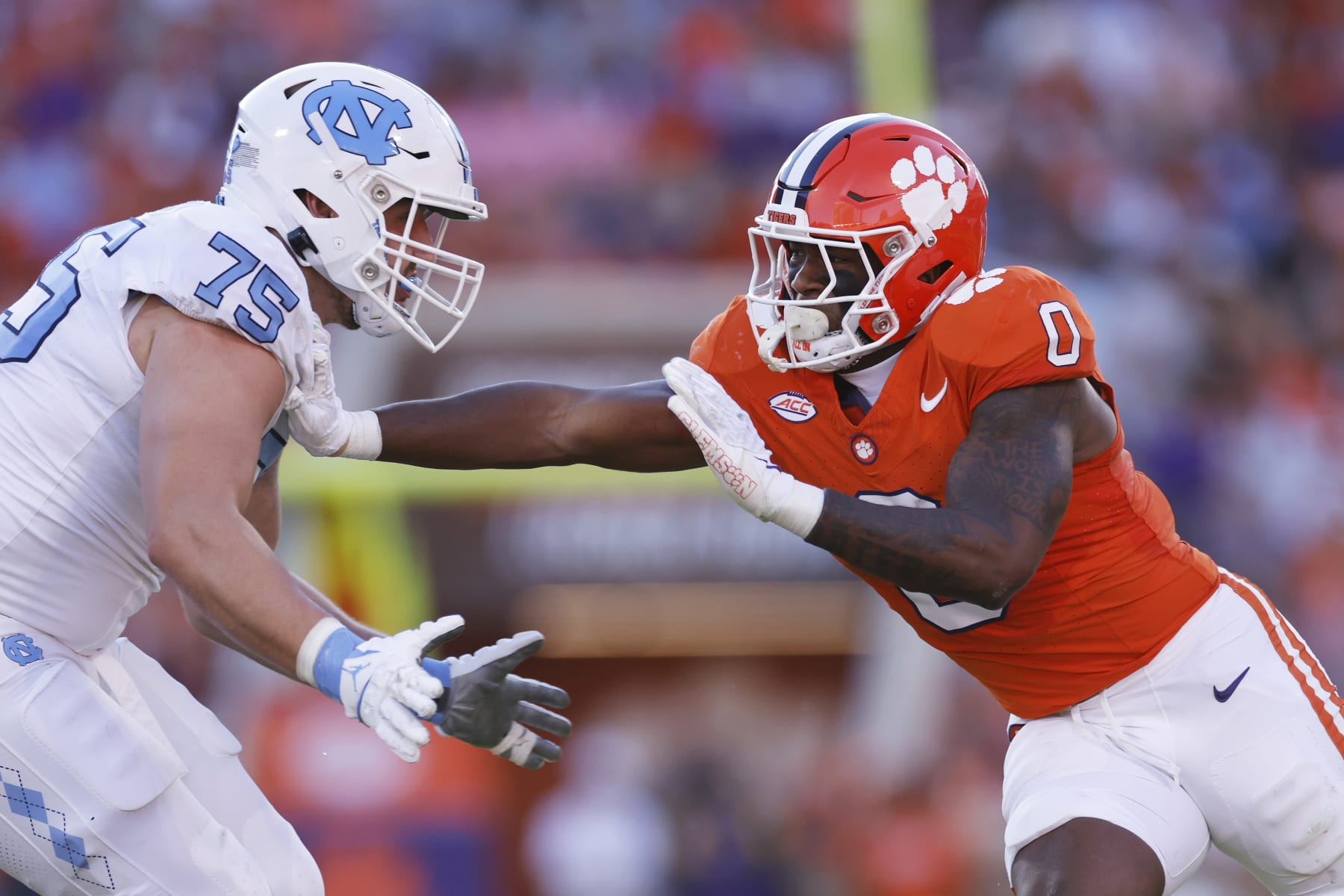 CLEMSON, SC - NOVEMBER 18: Clemson Tigers linebacker Barrett Carter (0) rushes while blocked by North Carolina Tar Heels offensive lineman Spencer Rolland (75) during a college football game on November 18, 2023 at Memorial Stadium in Clemson, South Carolina. (Photo by Joe Robbins/Icon Sportswire via Getty Images)