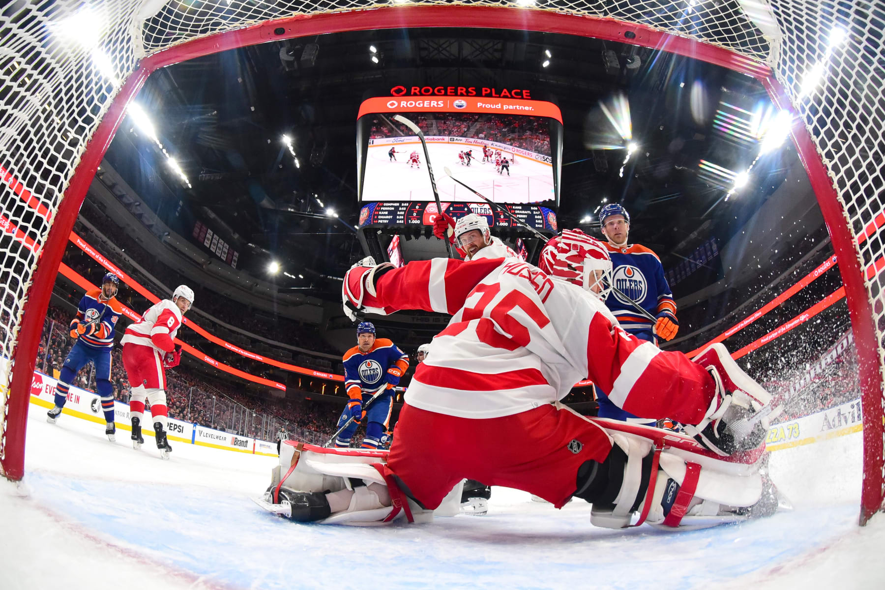 EDMONTON, CANADA - FEBRUARY 13: Leon Draisaitl #29 of the Edmonton Oilers scores a first-period goal against Ville Husso #35 of the Detroit Red Wings during the game at Rogers Place on February 13, 2024, in Edmonton, Alberta, Canada. (Photo by Andy Devlin/NHLI via Getty Images)