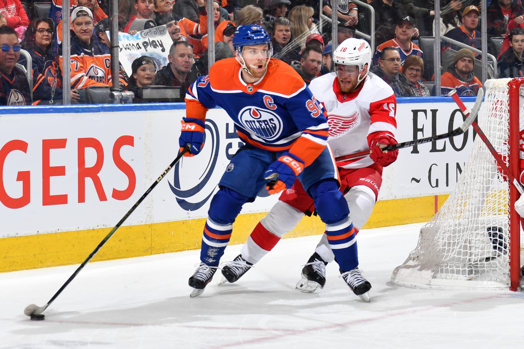 EDMONTON, CANADA - FEBRUARY 13: Connor McDavid #97 of the Edmonton Oilers skates against Andrew Copp #18 of the Detroit Red Wings during the game at Rogers Place on February 13, 2024, in Edmonton, Alberta, Canada. (Photo by Andy Devlin/NHLI via Getty Images)