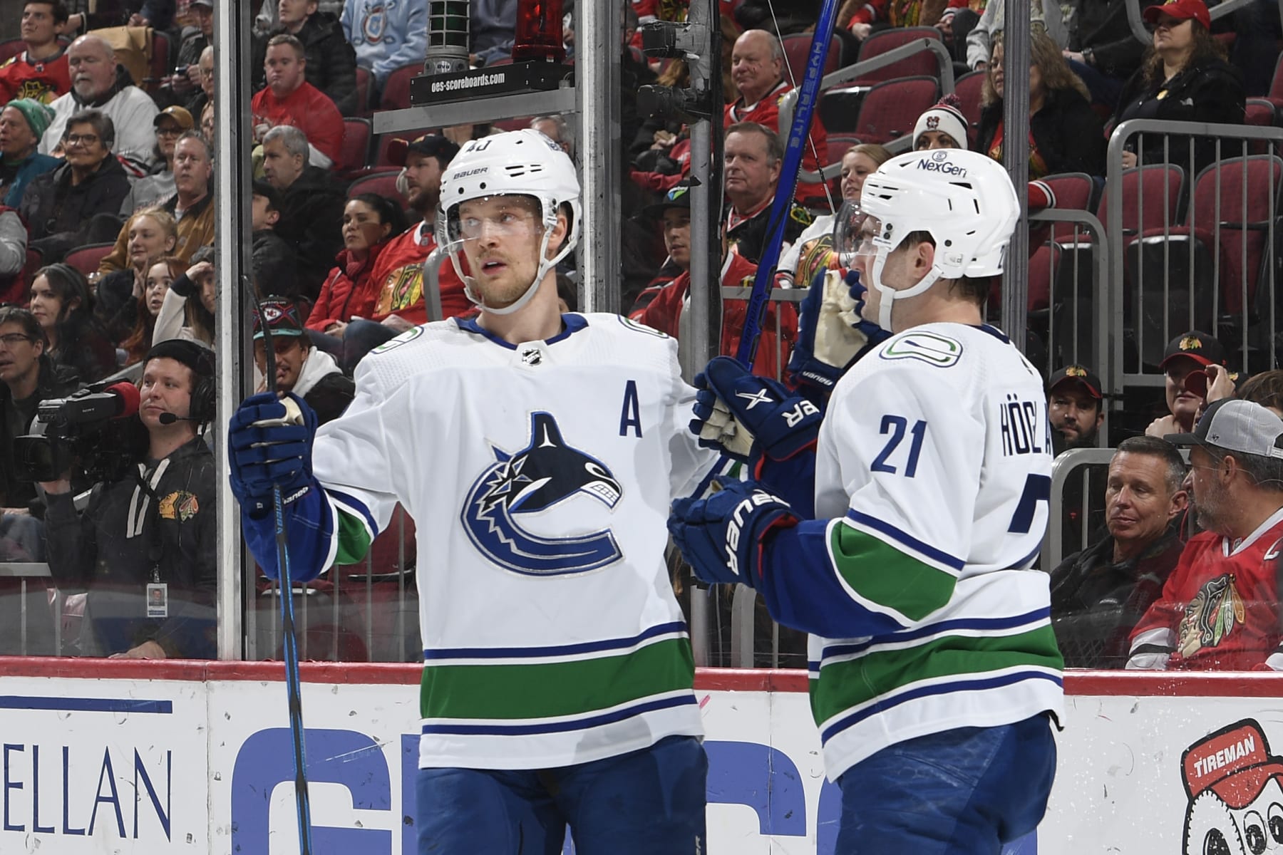 CHICAGO, ILLINOIS - FEBRUARY 13: Elias Pettersson #40 and Nils Hoglander #21 of the Vancouver Canucks celebrate after scoring against the Chicago Blackhawks in the second period at the United Center on February 13, 2024 in Chicago, Illinois. (Photo by Bill Smith/NHLI via Getty Images)