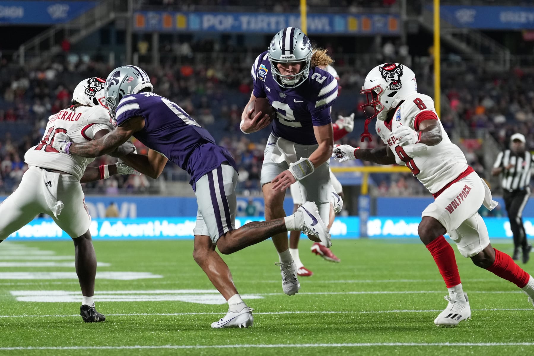 ORLANDO, FL - DECEMBER 28: Kansas State Wildcats quarterback Avery Johnson (2) runs for a touchdown in the first half during the Pop-Tarts Bowl between the North Carolina State Wolfpack and the Kansas State Wildcats on Thursday, December 28, 2023 at Camping World Stadium, Orlando, Fla. (Photo by Peter Joneleit/Icon Sportswire via Getty Images)