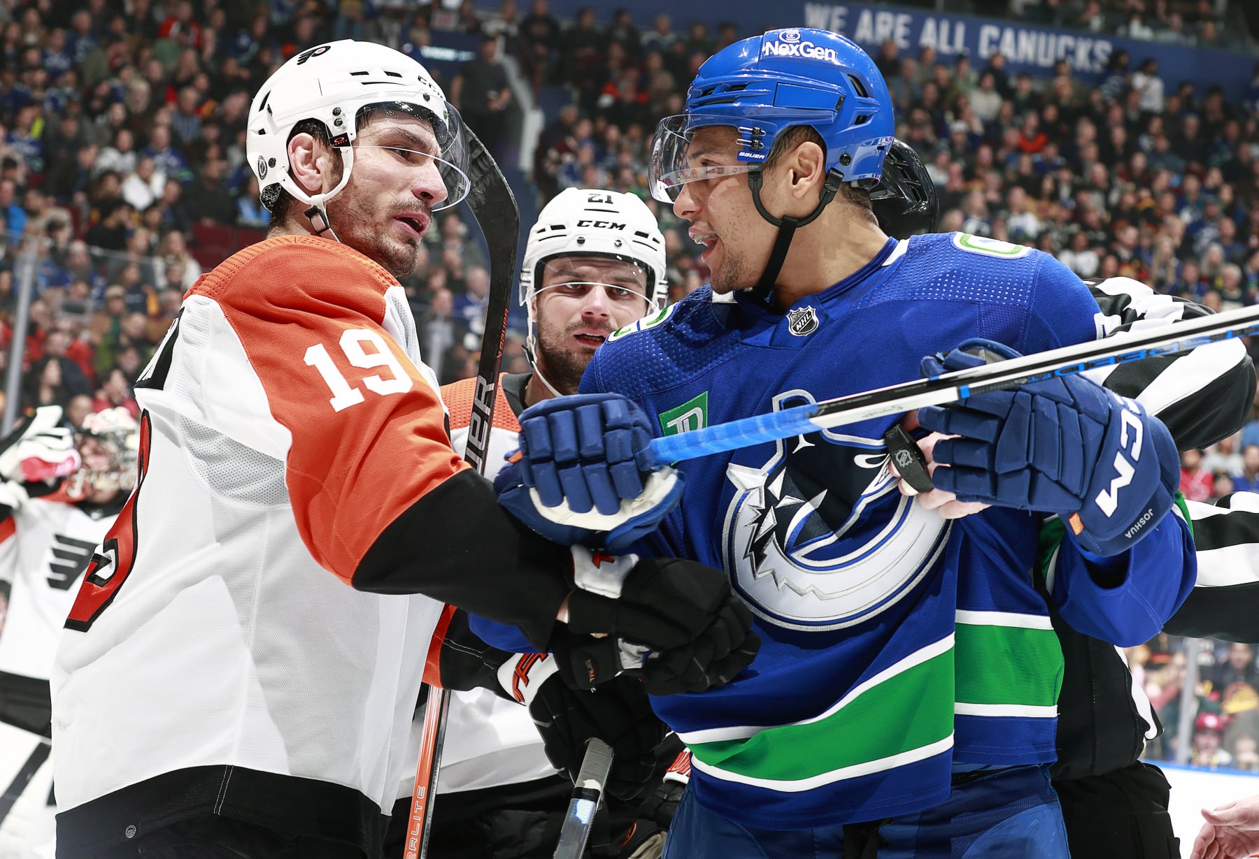 VANCOUVER, CANADA - DECEMBER 28: Dakota Joshua #81 of the Vancouver Canucks and Garnet Hathaway #19 of the Philadelphia Flyers exchange words during their NHL game at Rogers Arena on December 28, 2023 in Vancouver, British Columbia, Canada. (Photo by Jeff Vinnick/NHLI via Getty Images)