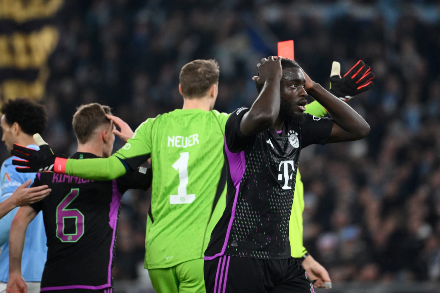 Bayern Munich's French defender #02 Dayot Upamecano (R) reacts after he received a red card from French referee Francois Letexier during the UEFA Champions League last 16 first leg between Lazio and Bayern Munich at the Olympic stadium on February 14, 2024 in Rome. (Photo by Alberto PIZZOLI / AFP) (Photo by ALBERTO PIZZOLI/AFP via Getty Images)