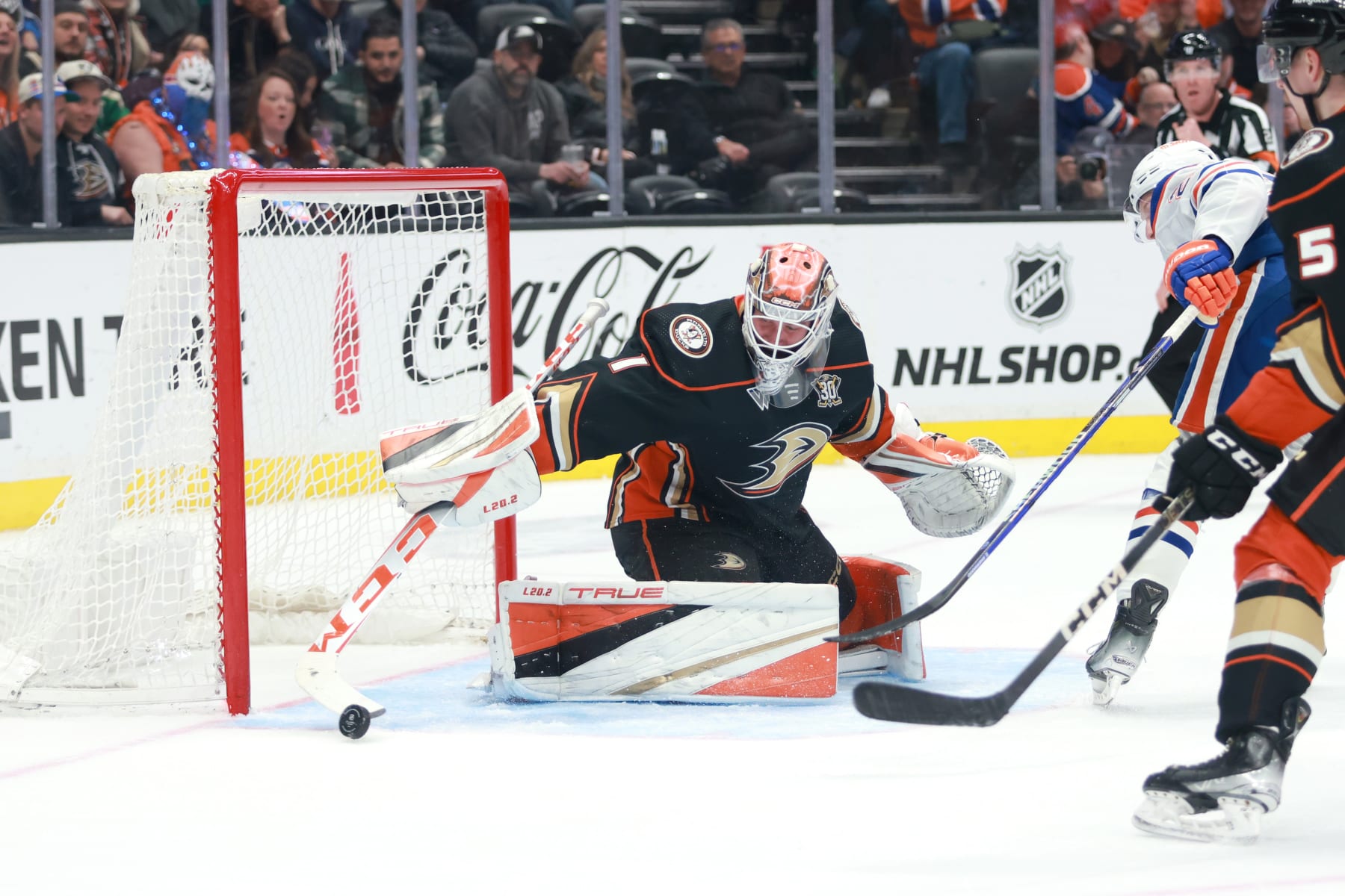 ANAHEIM, CALIFORNIA - FEBRUARY 09: Lukas Dostal #1 of the Anaheim Ducks deflects the puck in the third period during the game against the Edmonton Oilers at Honda Center on February 09, 2024 in Anaheim, California. (Photo by Nicole Vasquez /NHLI via Getty Images)