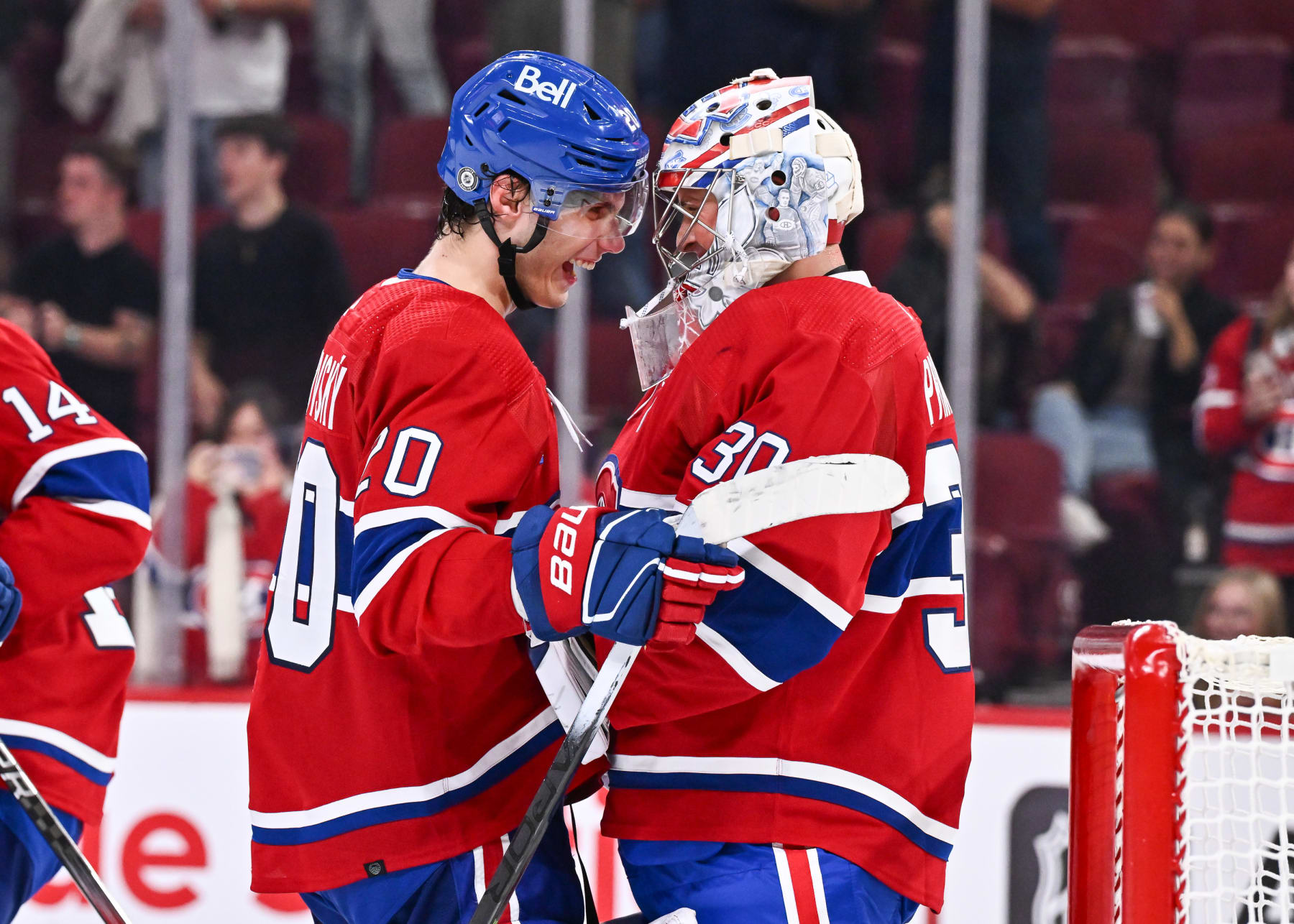 MONTREAL, CANADA - SEPTEMBER 27: Juraj Slafkovsky #20 and Cayden Primeau #30 of the Montreal Canadiens celebrate a victory against the Ottawa Senators at the Bell Centre on September 27, 2023 in Montreal, Quebec, Canada. The Montreal Canadiens defeated the Ottawa Senators 4-3. (Photo by Minas Panagiotakis/Getty Images)