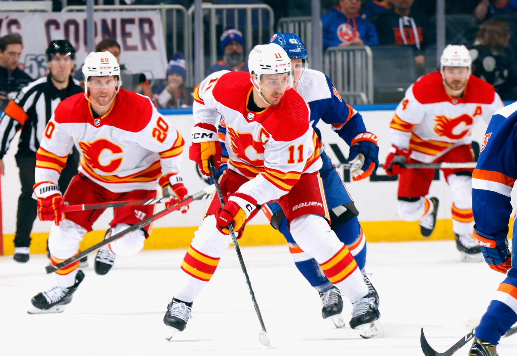 ELMONT, NEW YORK - FEBRUARY 10: Mikael Backlund #11 of the Calgary Flames skates against the New York Islanders at UBS Arena on February 10, 2024 in Elmont, New York. (Photo by Bruce Bennett/Getty Images)