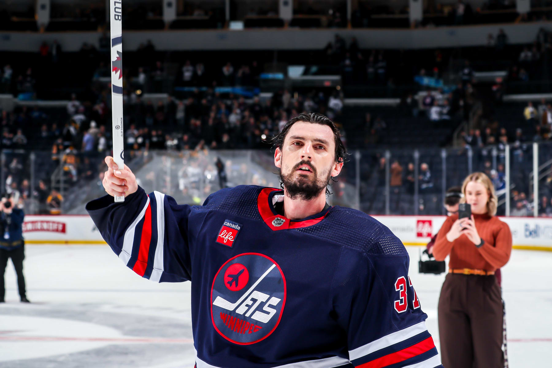 WINNIPEG, CANADA - FEBRUARY 10: Goaltender Connor Hellebuyck #37 of the Winnipeg Jets salutes the fans after receiving first star honours following a 2-1 victory over the Pittsburgh Penguins at the Canada Life Centre on February 10, 2024 in Winnipeg, Manitoba, Canada. (Photo by Darcy Finley/NHLI via Getty Images)