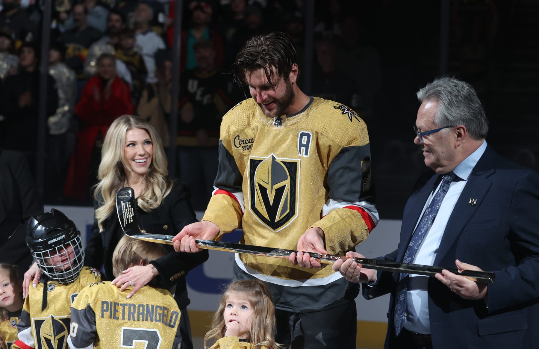 LAS VEGAS, NEVADA - FEBRUARY 12: Alex Pietrangelo #7 of the Vegas Golden Knights is honored with a golden hockey stick prior to his 1,000th career NHL game at T-Mobile Arena on February 12, 2024 in Las Vegas, Nevada. (Photo by Zak Krill/NHLI via Getty Images)