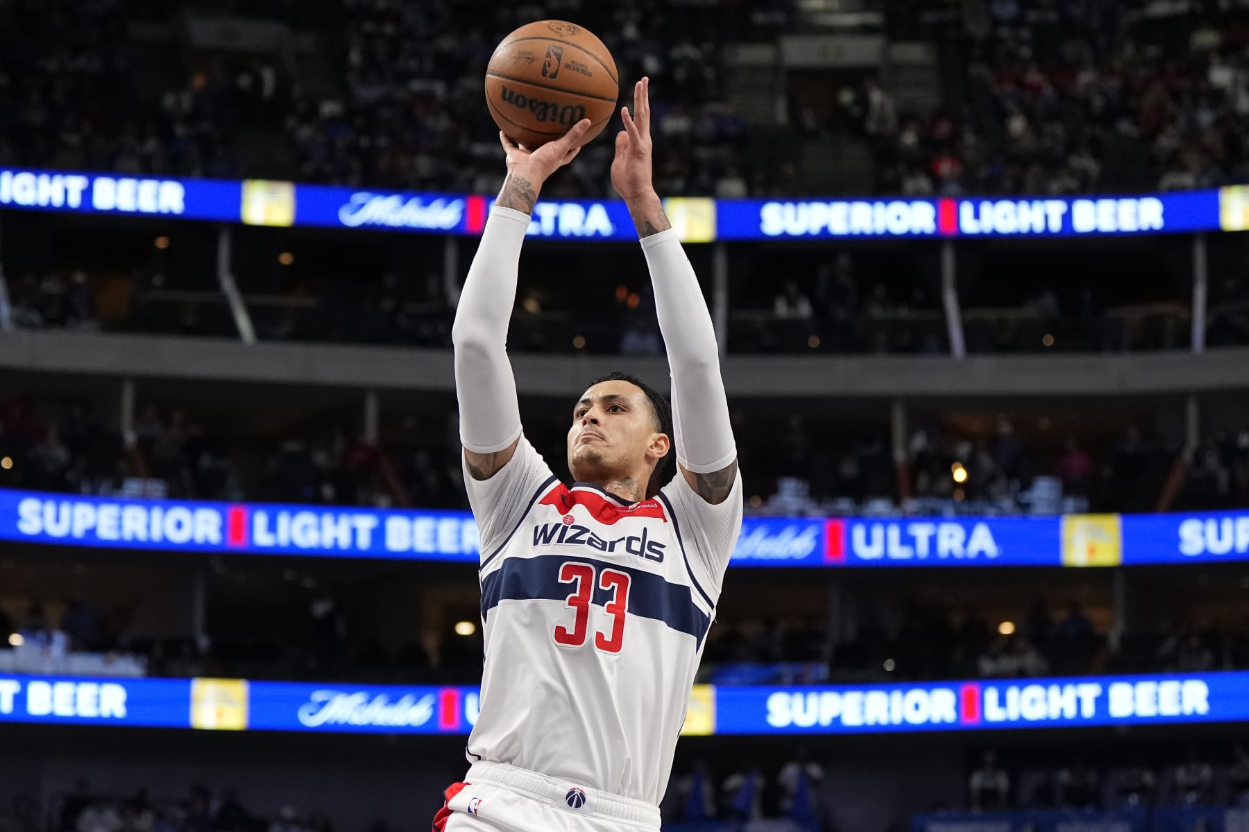 DALLAS, TEXAS - FEBRUARY 12: Kyle Kuzma #33 of the Washington Wizards shoots during the first half against the Dallas Mavericks at American Airlines Center on February 12, 2024 in Dallas, Texas. NOTE TO USER: User expressly acknowledges and agrees that, by downloading and or using this photograph, User is consenting to the terms and conditions of the Getty Images License Agreement. (Photo by Sam Hodde/Getty Images)