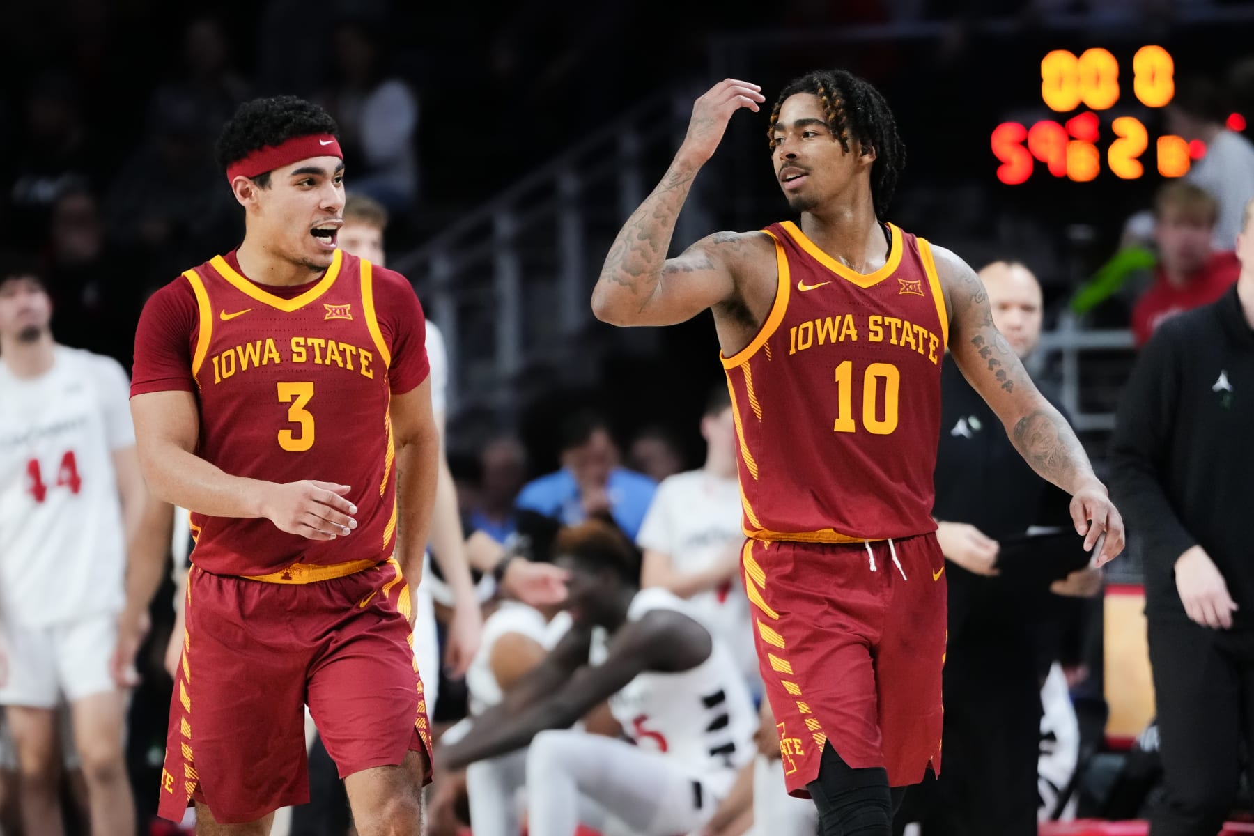 CINCINNATI, OHIO - FEBRUARY 13: Tamin Lipsey #3 and Keshon Gilbert #10 of the Iowa State Cyclones celebrate after beating the Cincinnati Bearcats 68-59 at Fifth Third Arena on February 13, 2024 in Cincinnati, Ohio. (Photo by Dylan Buell/Getty Images)