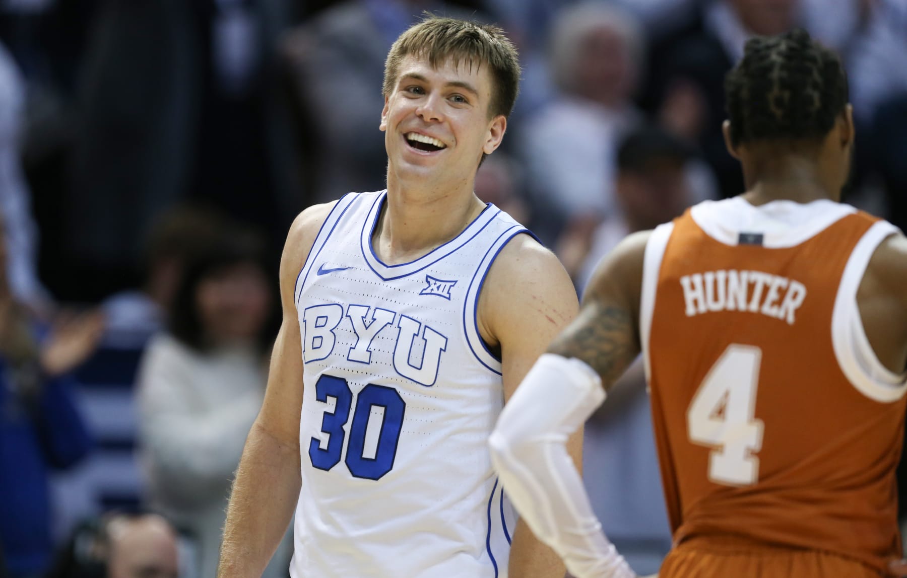 PROVO, UT - JANUARY 27: Dallin Hall #30 of the Brigham Young Cougars smiles as he walks off the court after their win against the Texas Longhorns at the Marriott Center on January 27, 2024 in Provo, Utah. (Photo by Chris Gardner/Getty Images)
