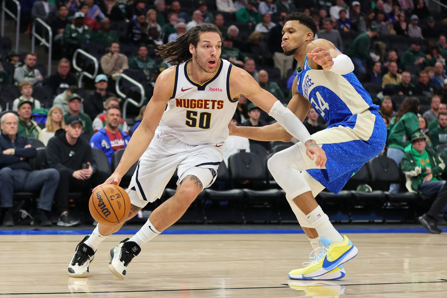 MILWAUKEE, WISCONSIN - FEBRUARY 12: Aaron Gordon #50 of the Denver Nuggets is defended by Giannis Antetokounmpo #34 of the Milwaukee Bucks during a game at Fiserv Forum on February 12, 2024 in Milwaukee, Wisconsin. NOTE TO USER: User expressly acknowledges and agrees that, by downloading and or using this photograph, User is consenting to the terms and conditions of the Getty Images License Agreement. (Photo by Stacy Revere/Getty Images)