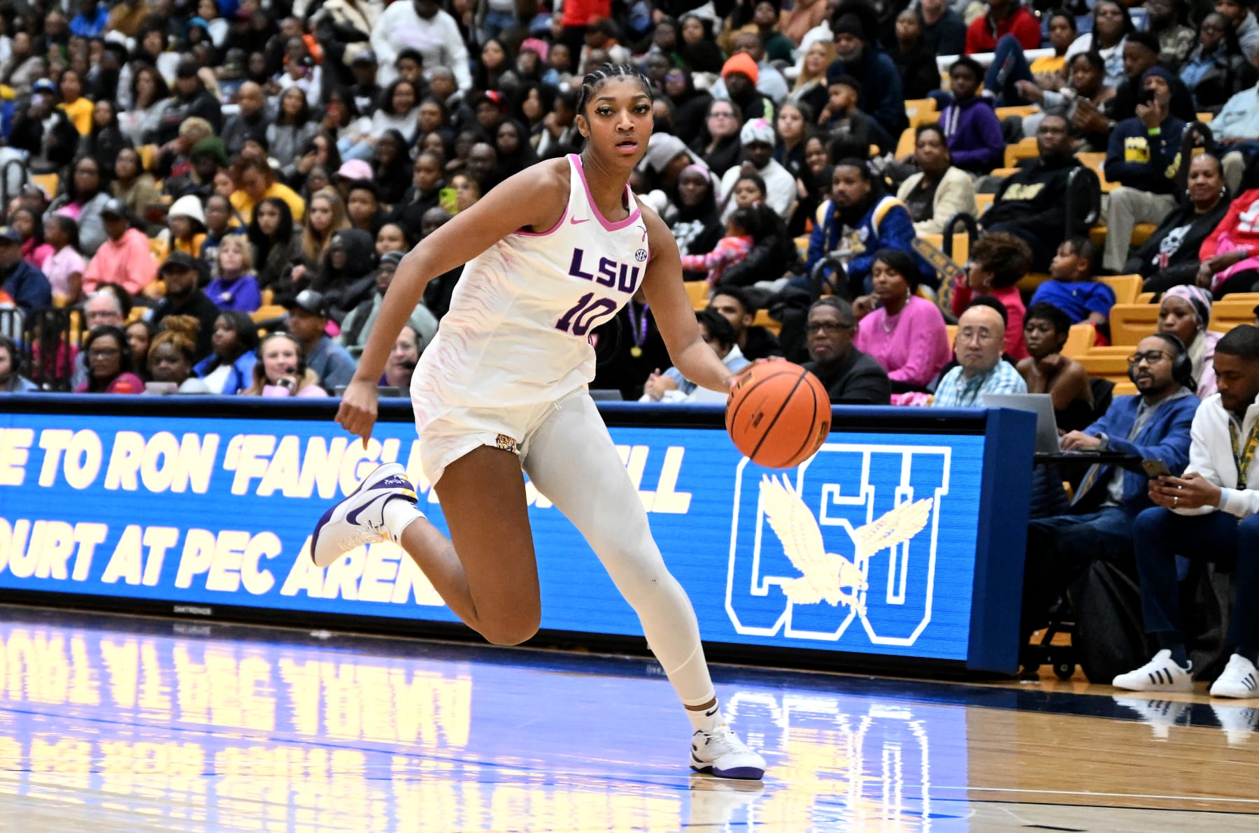 BALTIMORE, MARYLAND - DECEMBER 20: Angel Reese #10 of the LSU Lady Tigers handles the ball against the Coppin State Eagles at Coppin State University on December 20, 2023 in Baltimore, Maryland. (Photo by G Fiume/Getty Images)