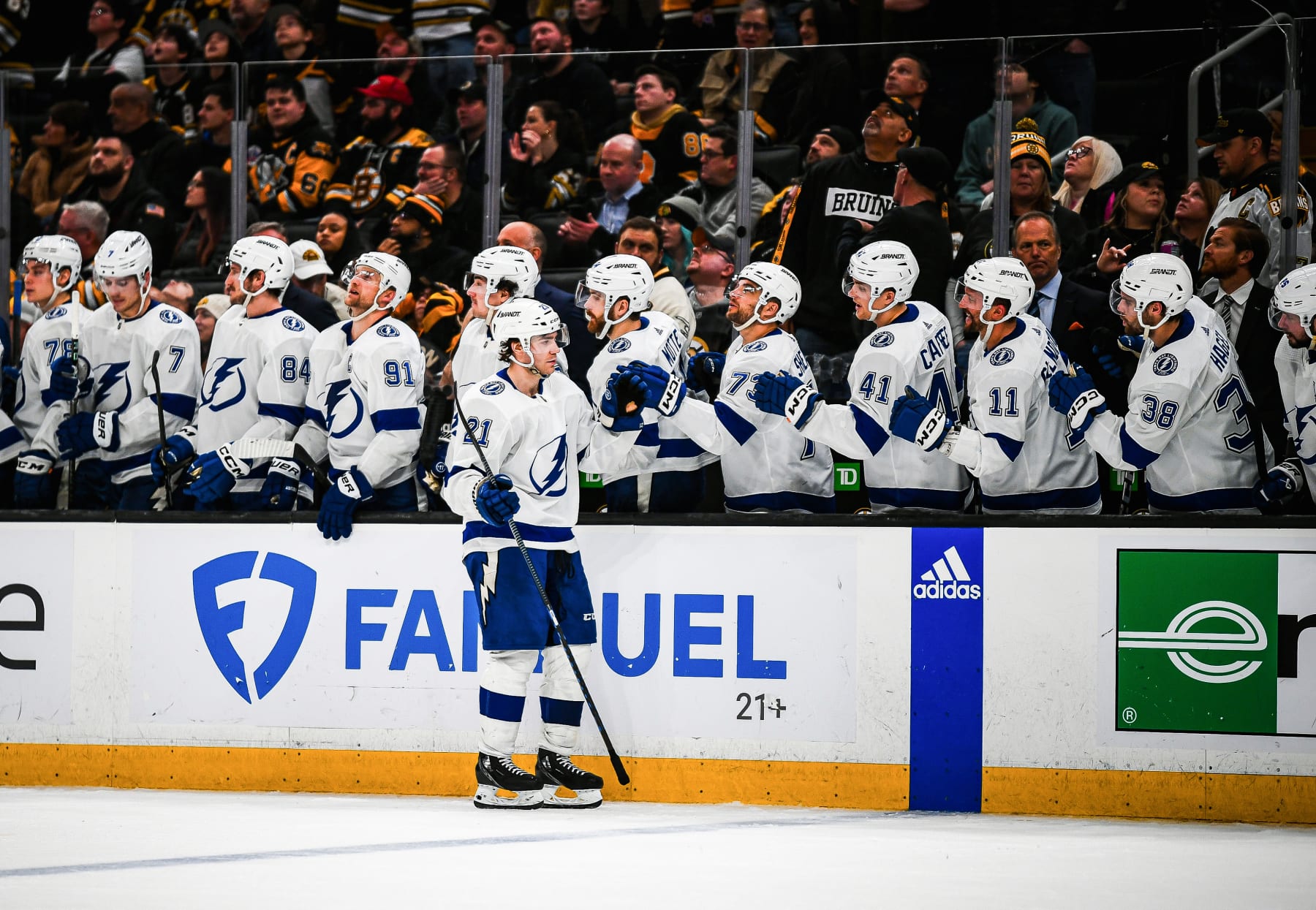 BOSTON, MASSACHUSETTS - FEBRUARY 13: Brayden Point #21 of the Tampa Bay Lightning celebrates his shootout goal with the bench against the Boston Bruins at TD Garden on February 13, 2024 in Boston, Massachusetts. (Photo by China Wong/NHLI via Getty Images)