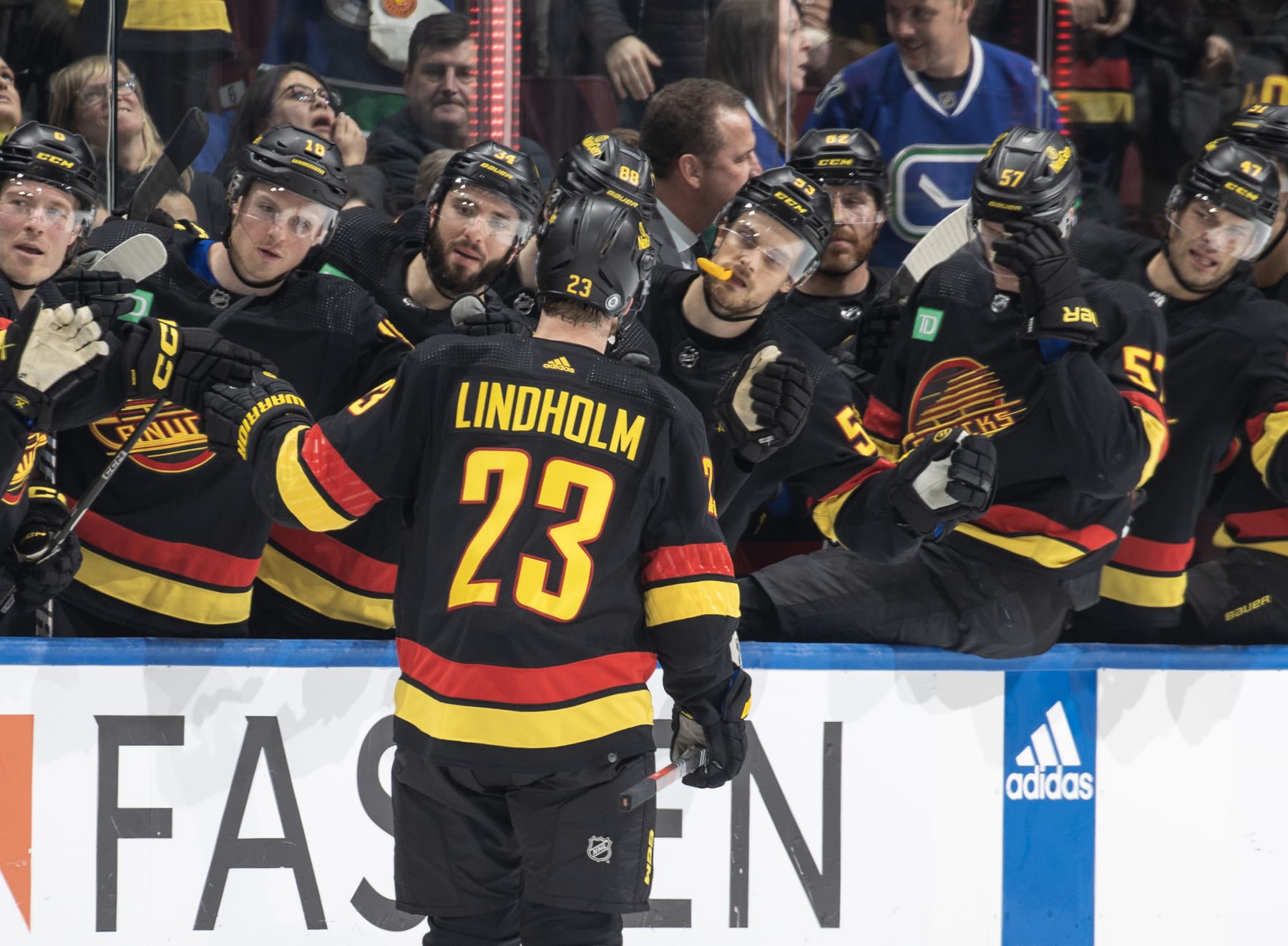 VANCOUVER, CANADA - FEBRUARY 15: Elias Lindholm #23 of the Vancouver Canucks celebrates his goal with teammates during the third period of their NHL game against the Detroit Red Wings at Rogers Arena on February 15, 2024 in Vancouver, British Columbia, Canada. (Photo by Jeff Vinnick/NHLI via Getty Images)
