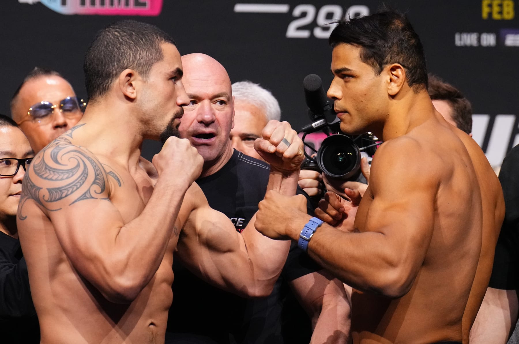 ANAHEIM, CALIFORNIA - FEBRUARY 16: (L-R) Opponents Robert Whittaker of New Zealand and Paulo Costa of Brazil face off during the UFC 298 ceremonial weigh-in at Honda Center on February 16, 2024 in Anaheim, California. (Photo by Chris Unger/Zuffa LLC via Getty Images)