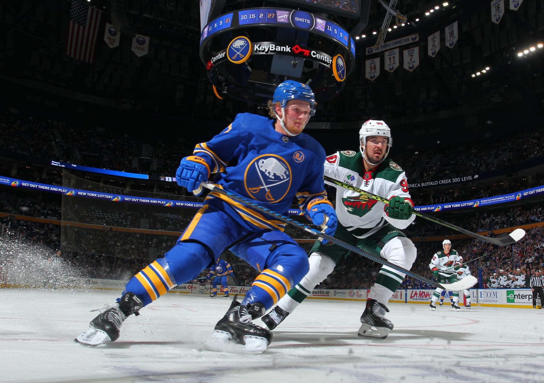 BUFFALO, NEW YORK - NOVEMBER 10: Casey Mittelstadt #37 of the Buffalo Sabres skates against Marcus Johansson #90 of the Minnesota Wild during an NHL game on November 10, 2023 at KeyBank Center in Buffalo, New York. Buffalo won, 3-2. (Photo by Bill Wippert/NHLI via Getty Images)