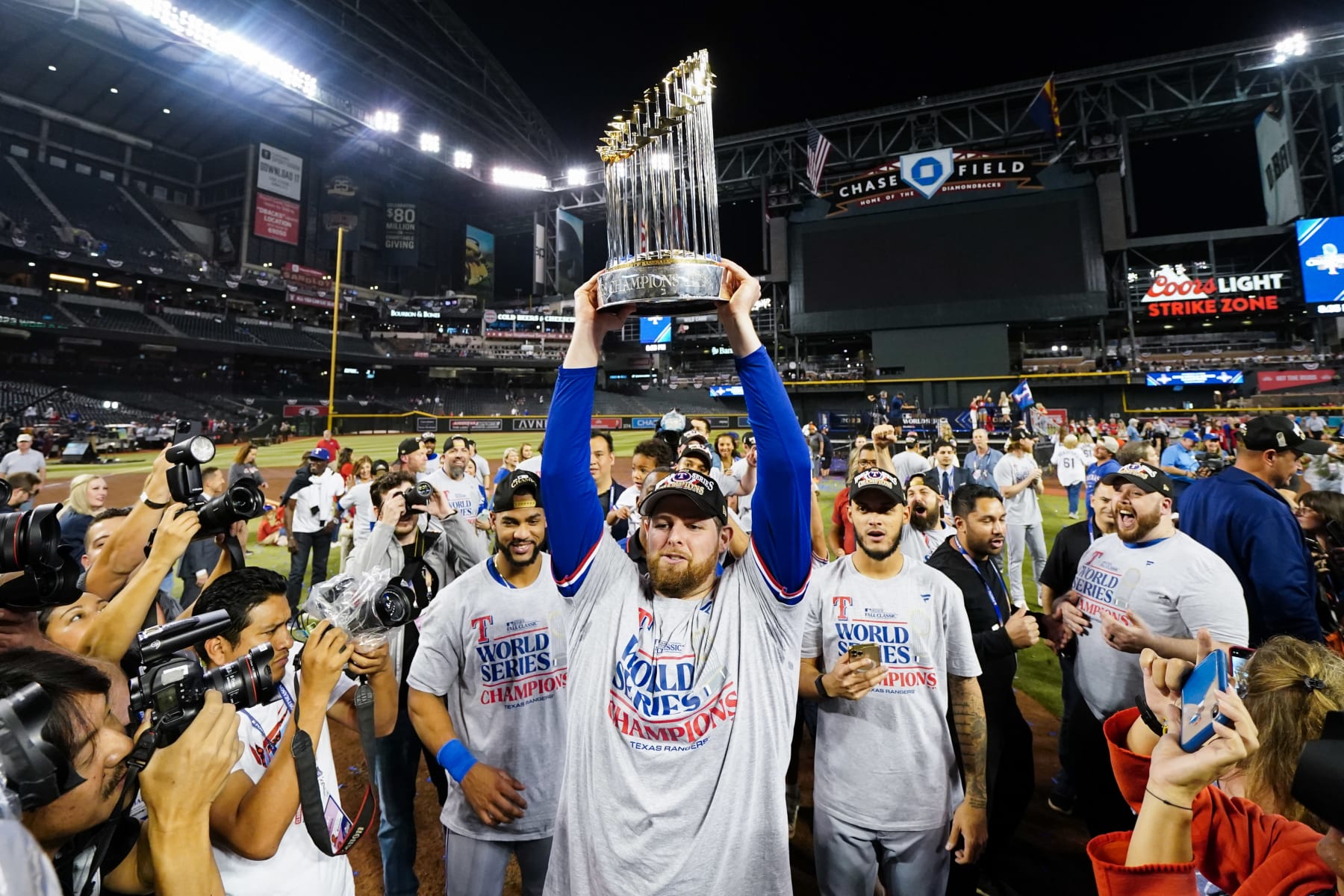 PHOENIX, AZ - NOVEMBER 01: Jordan Montgomery #52 of the Texas Rangers holds up the Commissioner's Trophy after winning Game 5 of the 2023 World Series between the Texas Rangers and the Arizona Diamondbacks at Chase Field on Wednesday, November 1, 2023 in Phoenix, Arizona. The Rangers defeated the Diamondbacks 5-0 to win the World Series. (Photo by Rob Tringali/MLB Photos via Getty Images)
