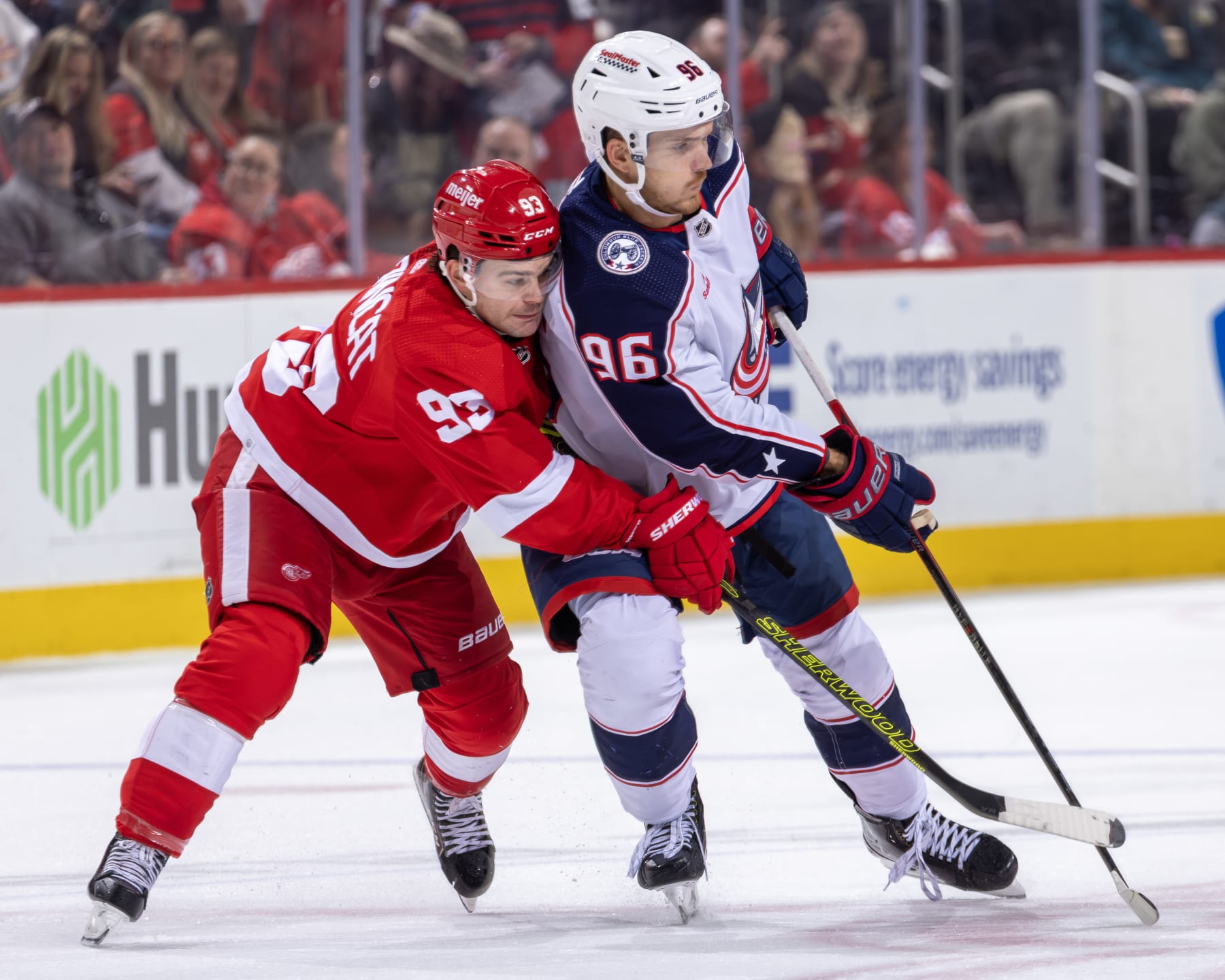 DETROIT, MI - NOVEMBER 11: Jack Roslovic #96 of the Columbus Blue Jackets battles for position with Alex DeBrincat #93 of the Detroit Red Wings during the second period at Little Caesars Arena on November 11, 2023 in Detroit, Michigan. Detroit defeated Columbus 5-4. (Photo by Dave Reginek/NHLI via Getty Images)